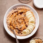 A bowl of vegan peanut butter banana oatmeal.