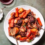 a plate of vegan pot roast with seitan beef.