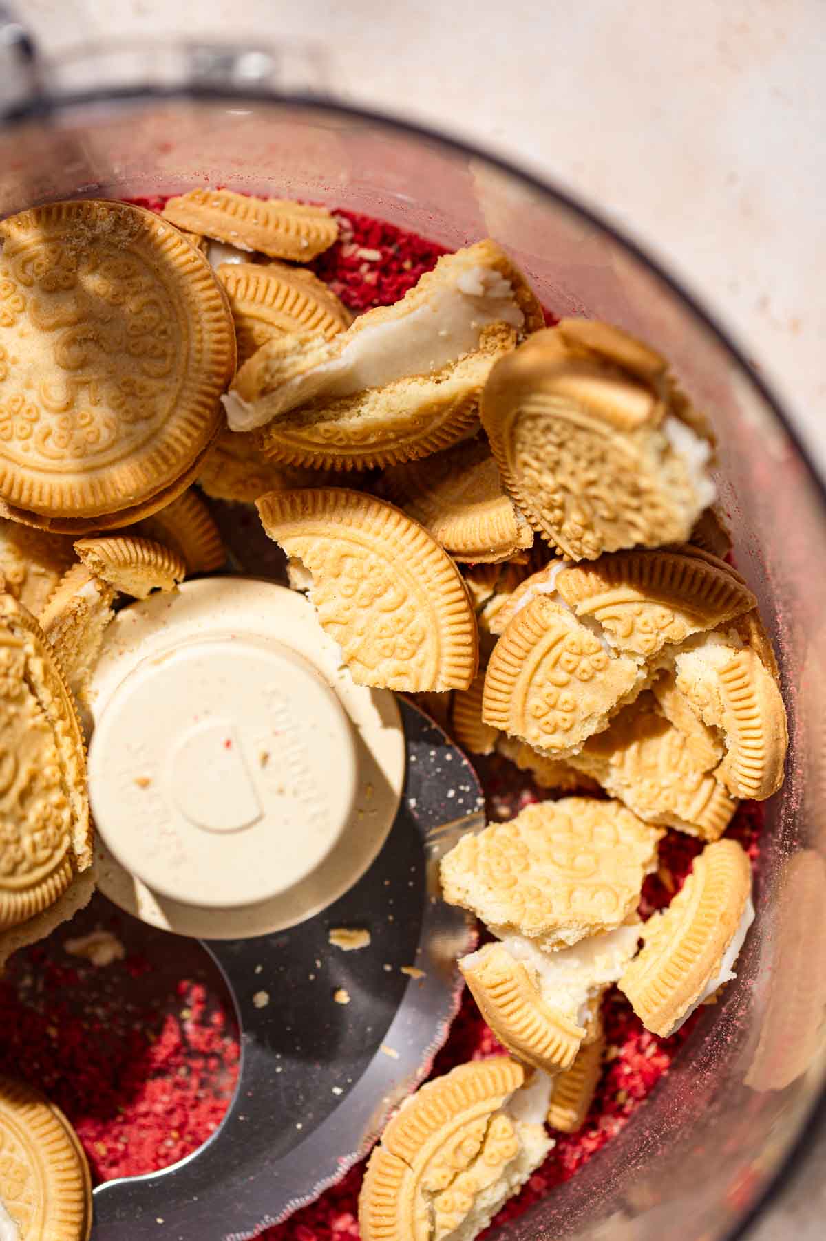 freeze dried strawberries and vanilla sandwich cookies in a food processor.