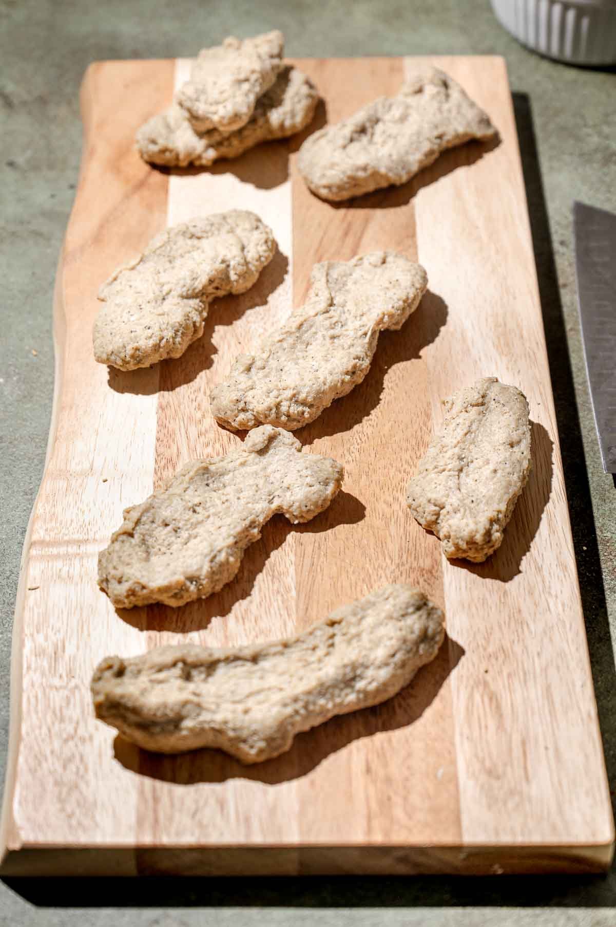 the vegan chicken wings from seitan on a cutting board.