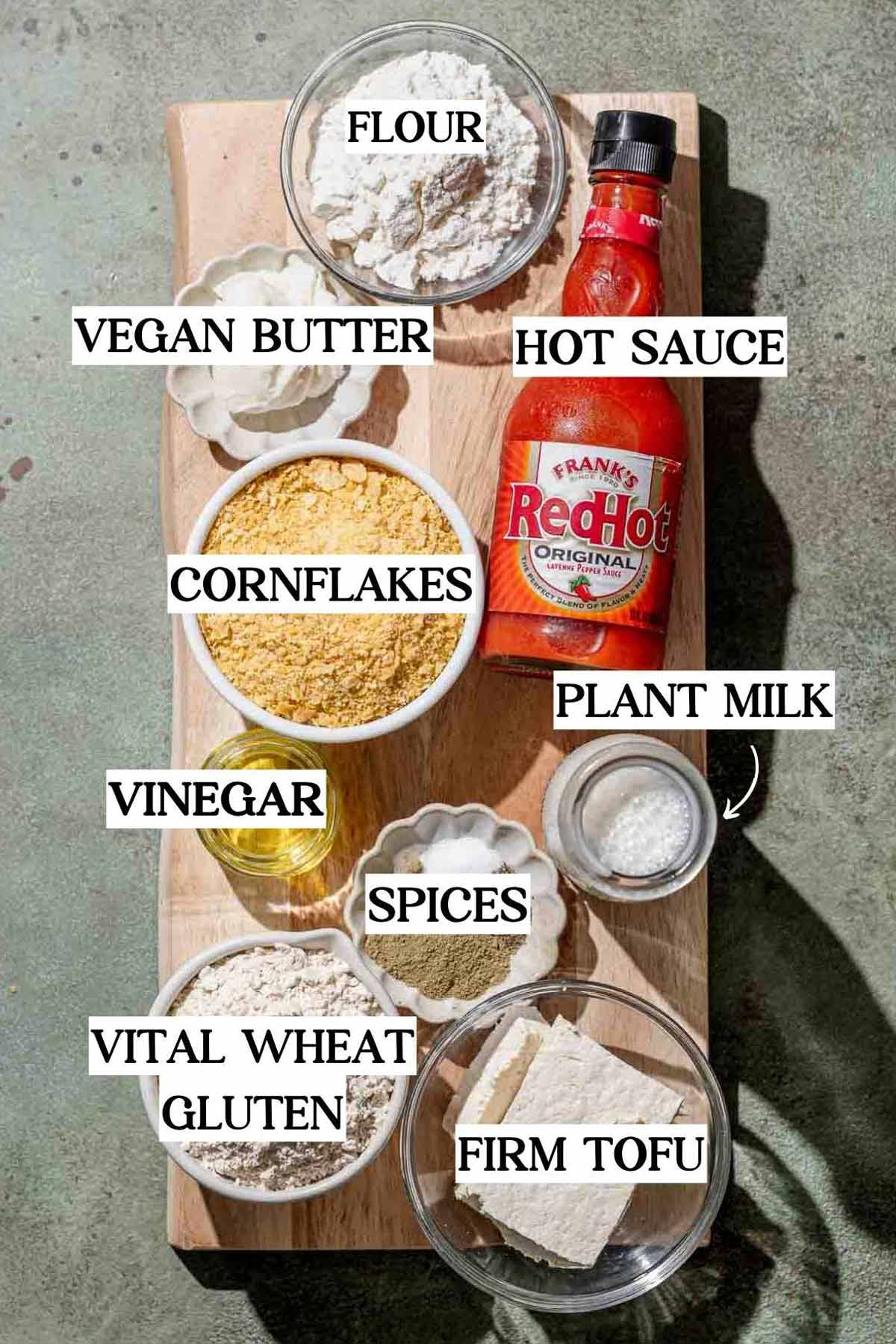 ingredients like vital wheat gluten, hot sauce, vegan butter and cornflakes for coating the vegan buffalo chicken.