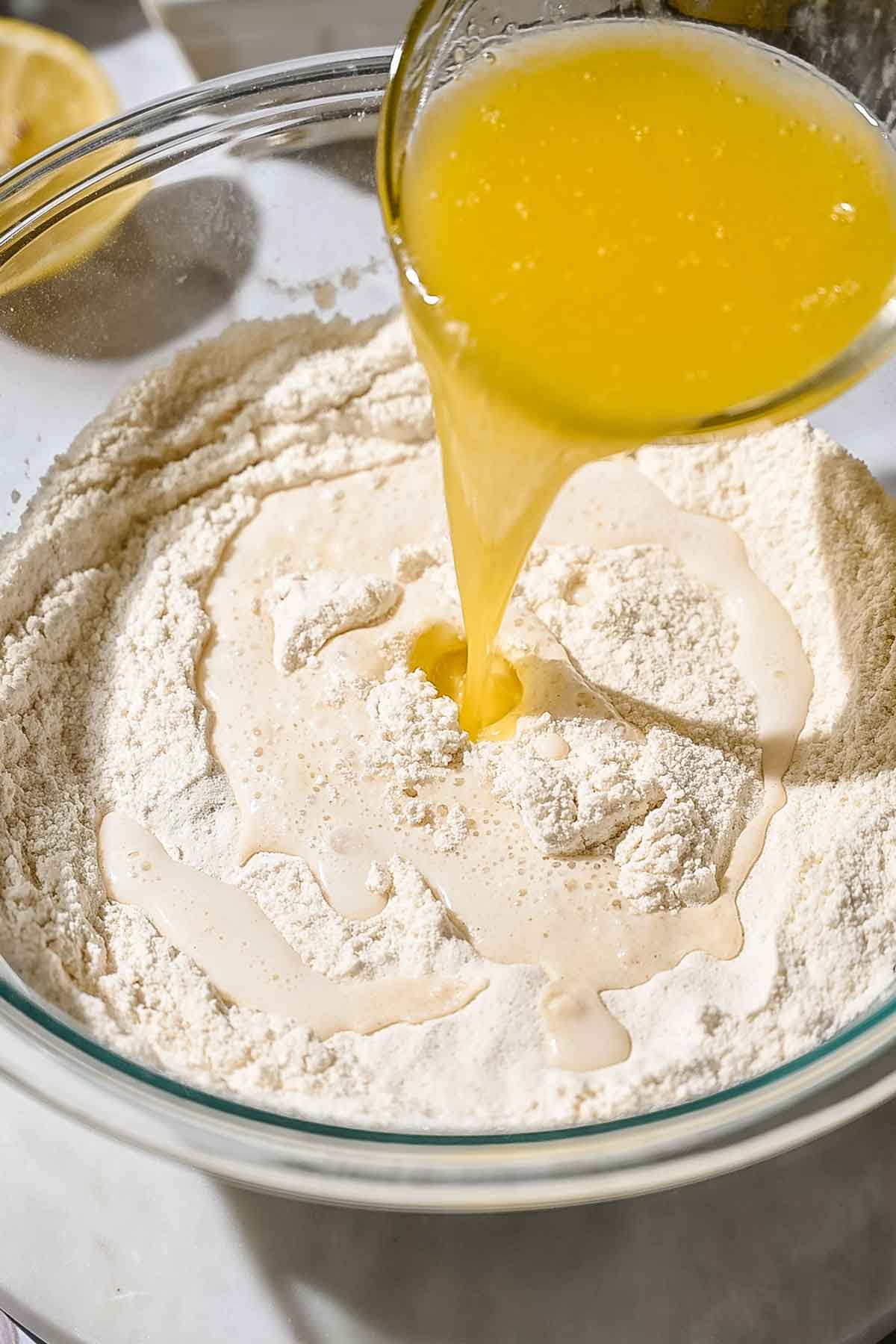 adding melted butter to the dry ingredients. 