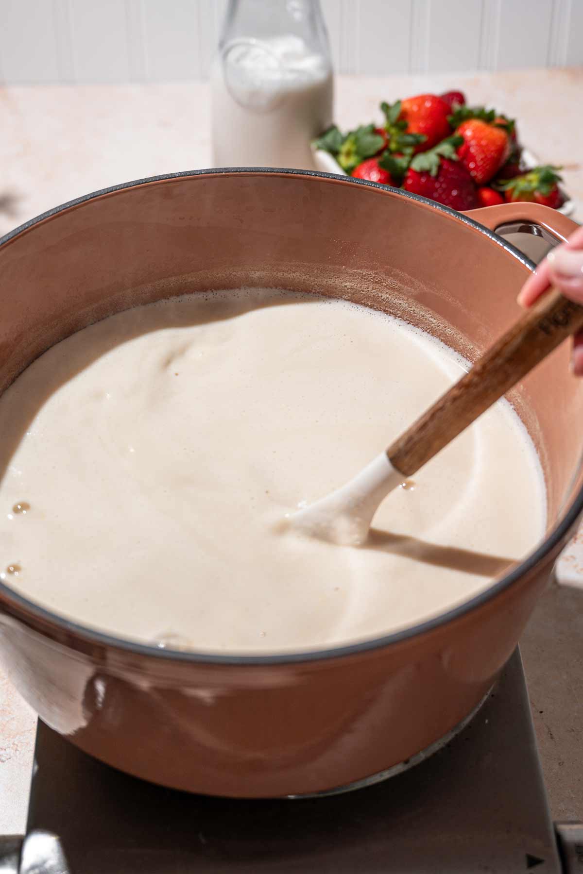 stirring the starter into the cooled soy milk.