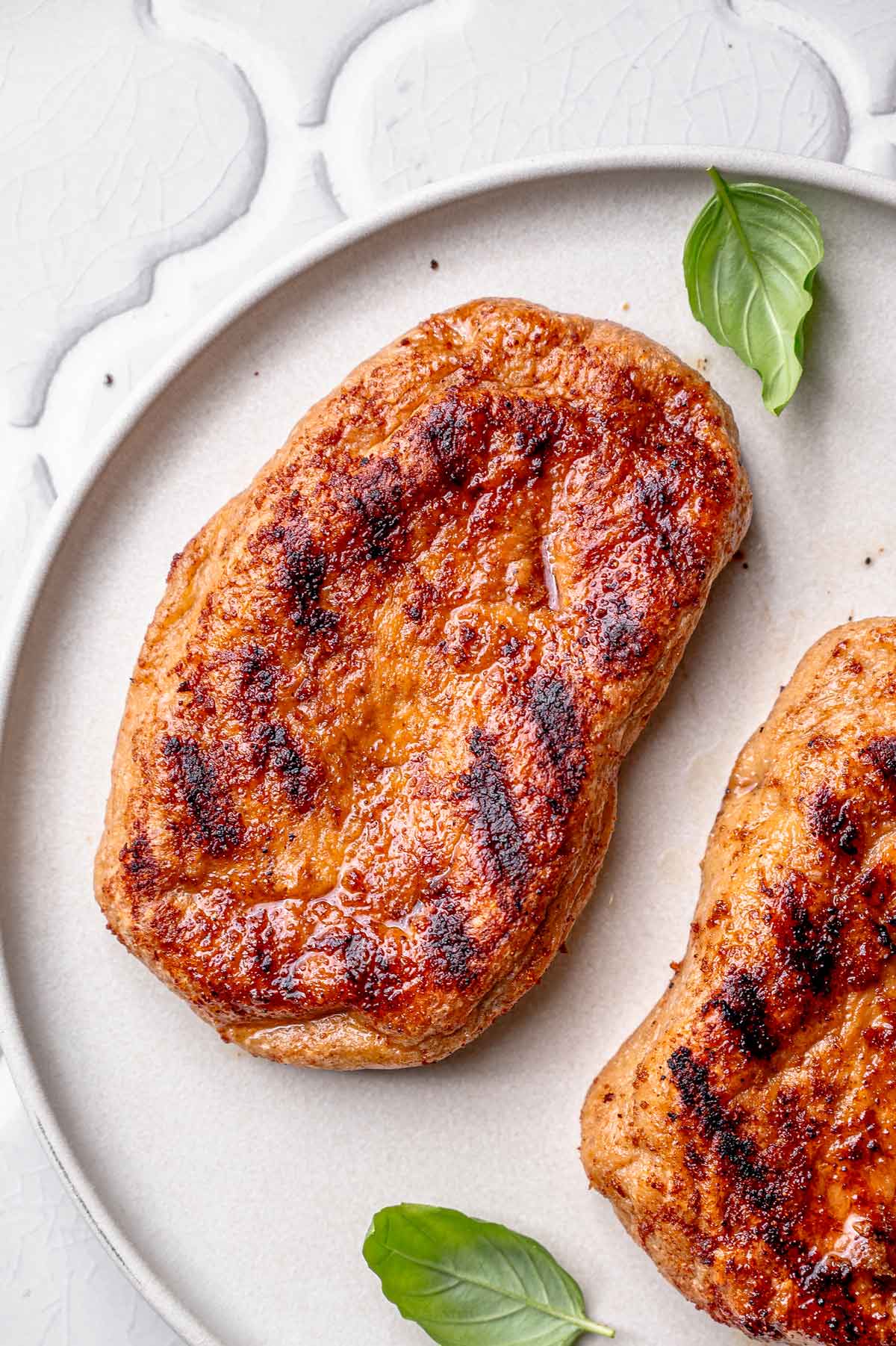 baked vegan seitan chicken on a plate.