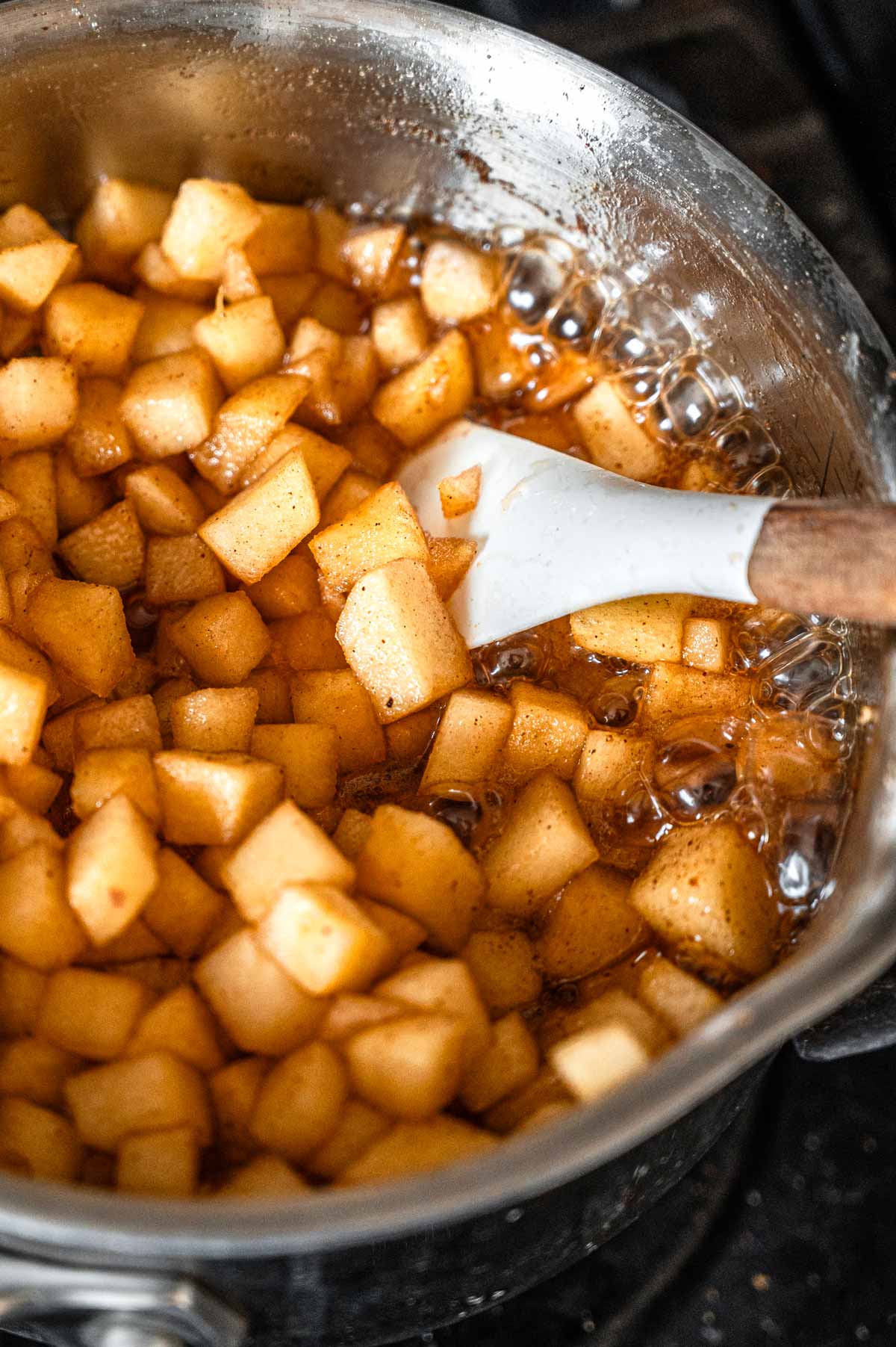 the cinnamon apples simmering on the stovetop.