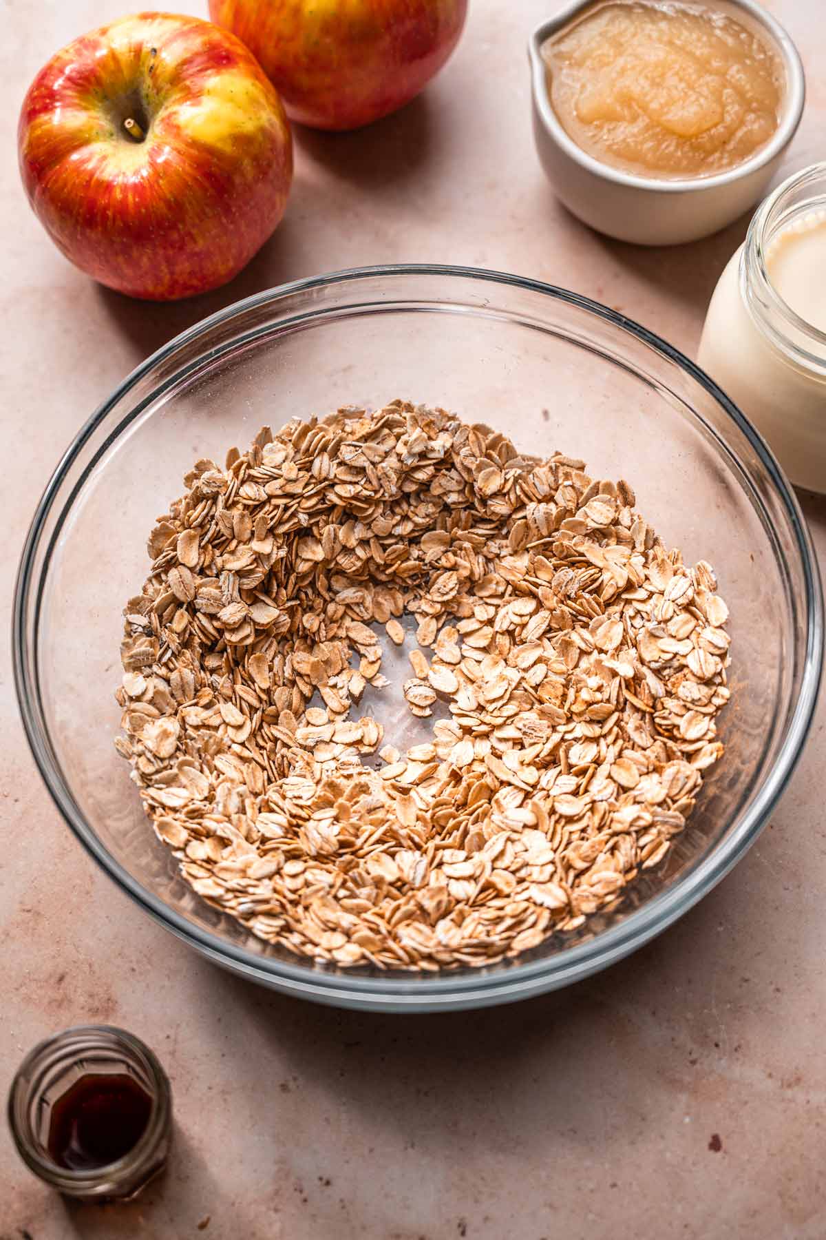 old fashioned oats, cinnamon and chia seeds whisked together in a glass bowl.