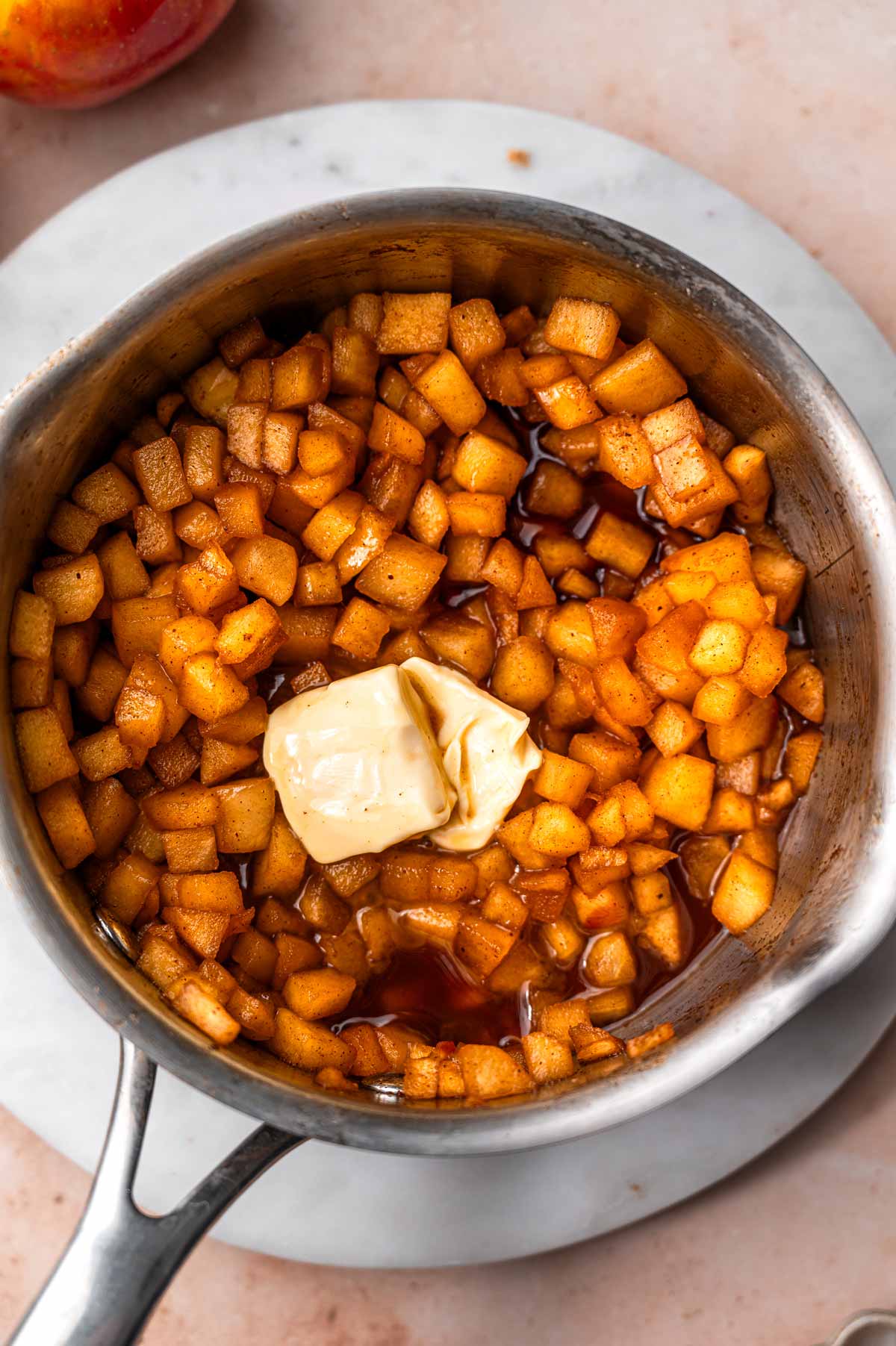 a few pats of butter on top of the cooked stovetop apples.