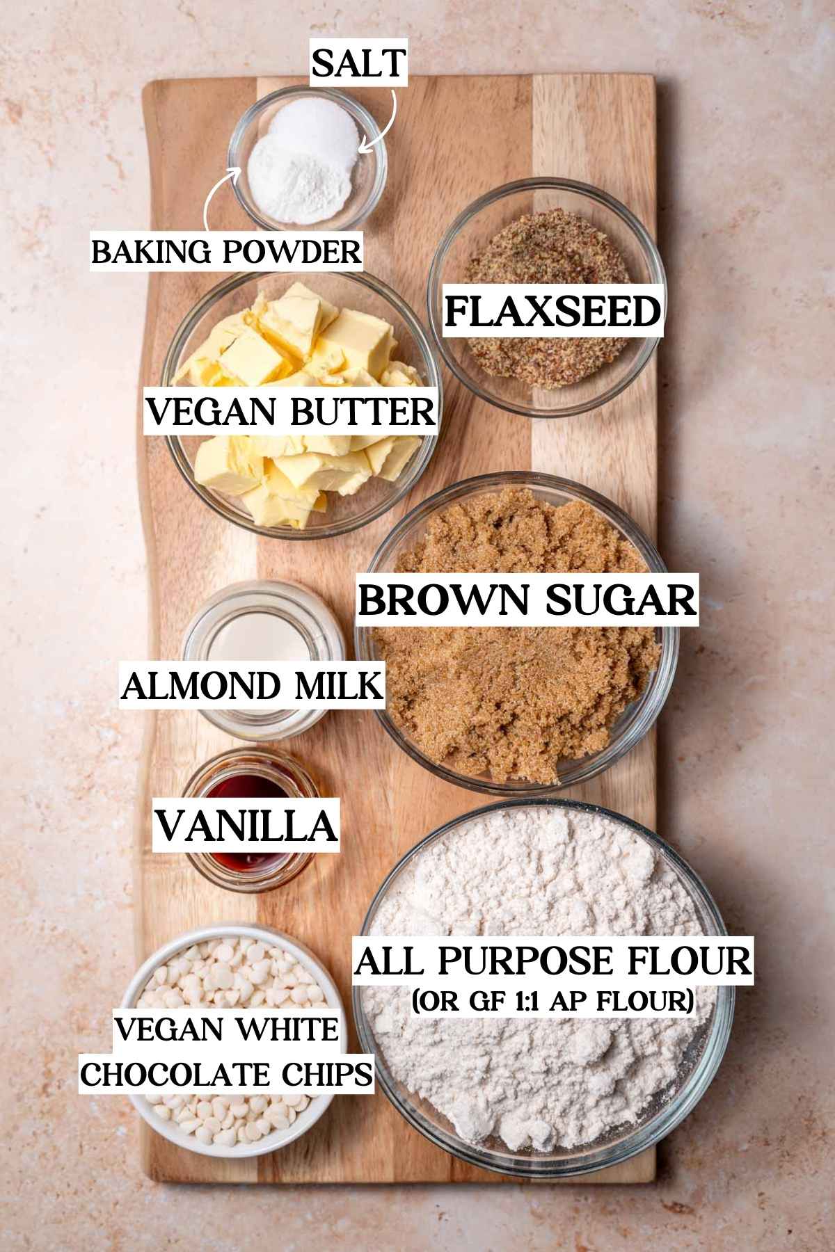 ingredients like vegan butter, flour, brown sugar and ground flaxseed on a wood cutting board.