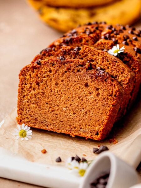 the best vegan pumpkin banana bread with chocolate chips on top.