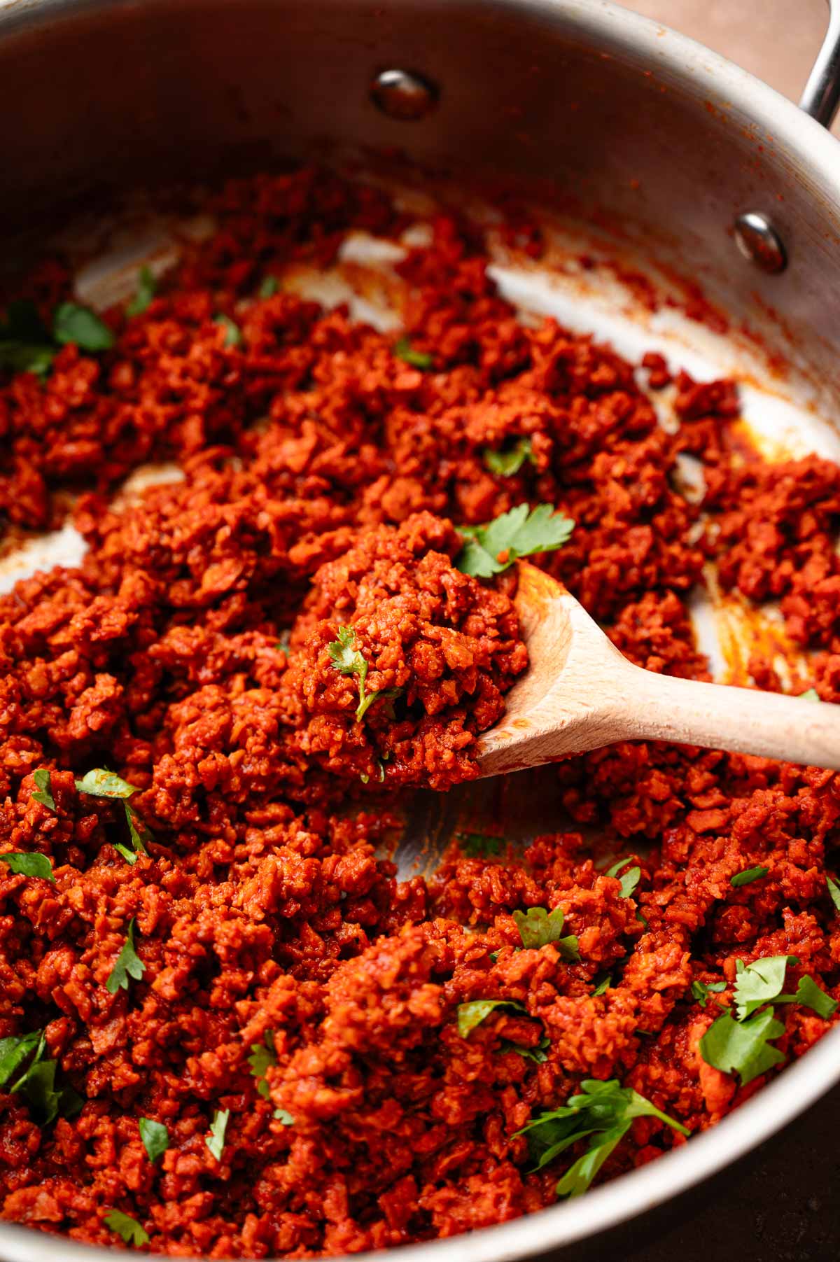 a pan with vegan chorizo made from TVP crumbles and paprika.