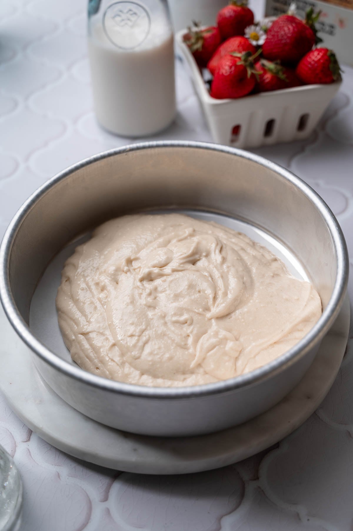 the cake batter in an eight inch baking pan.