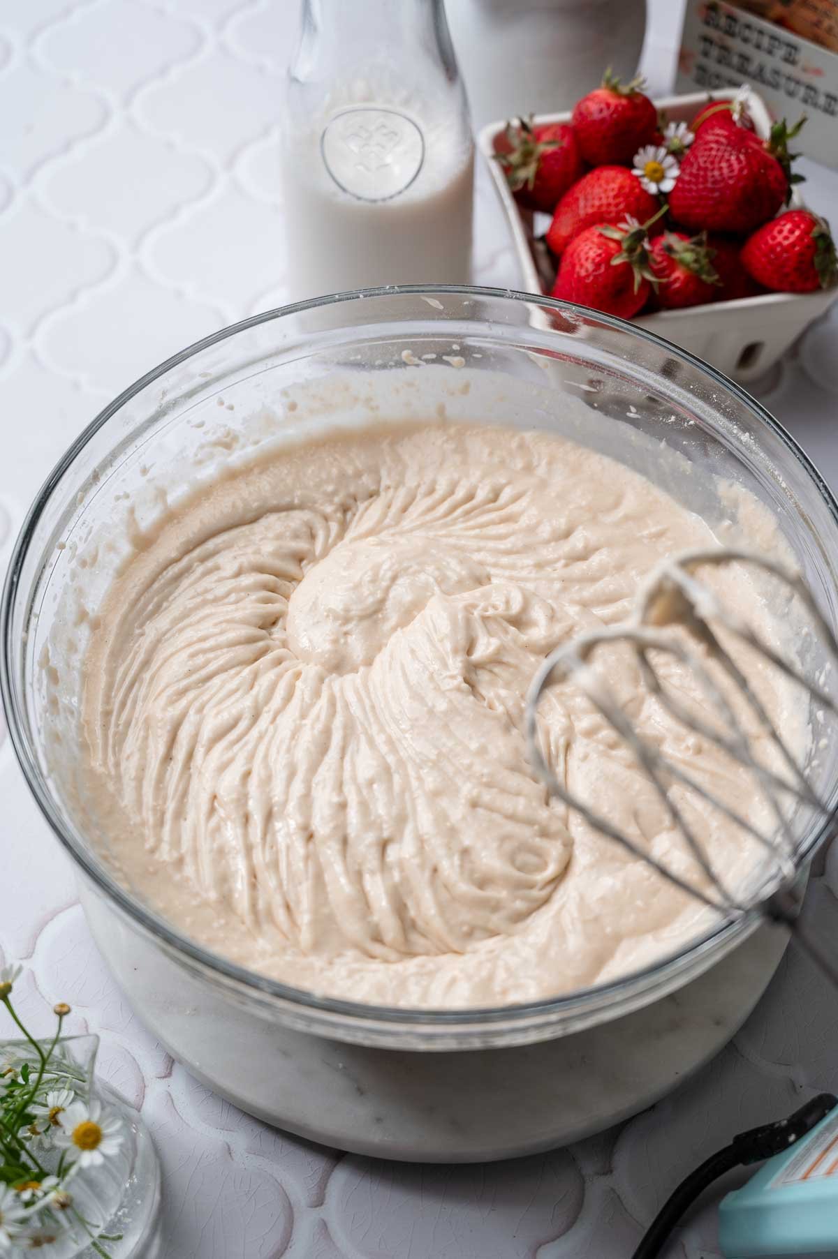 the vegan vanilla cake batter in a large glass bowl.
