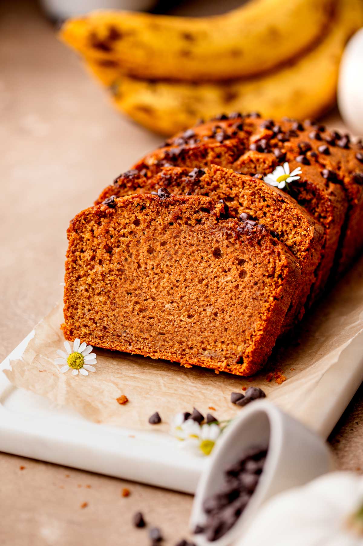 the sliced pumpkin banana bread on a marble tray.