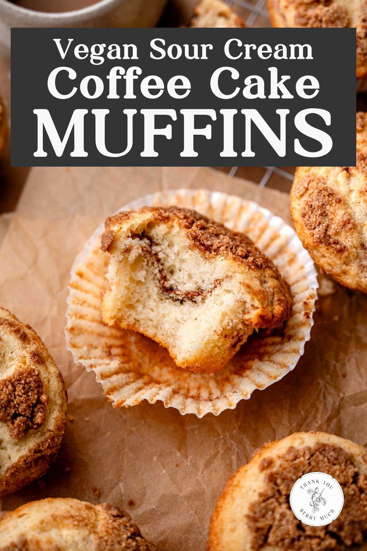 a image of a half eaten sour cream coffee cake muffin with a text overlay.