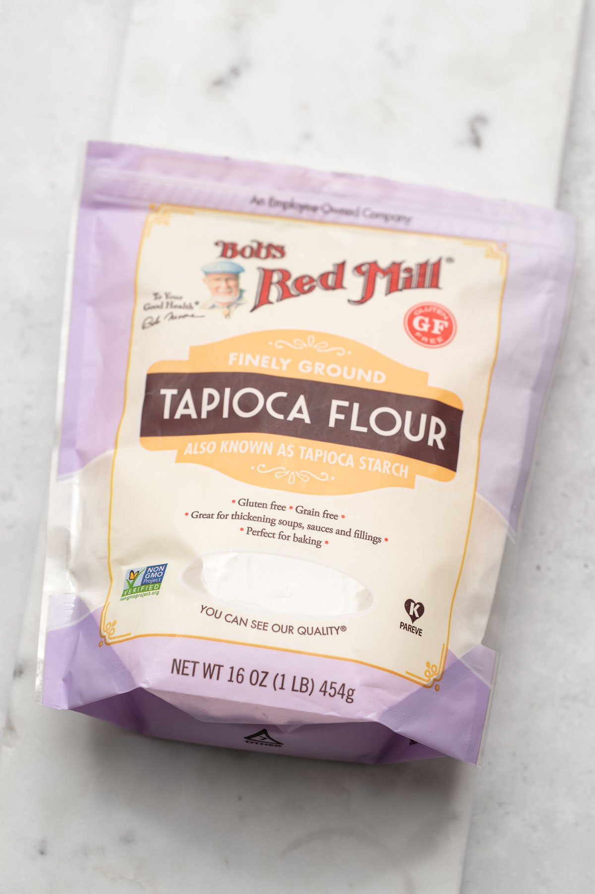 a package of tapioca starch on a marble cutting board.