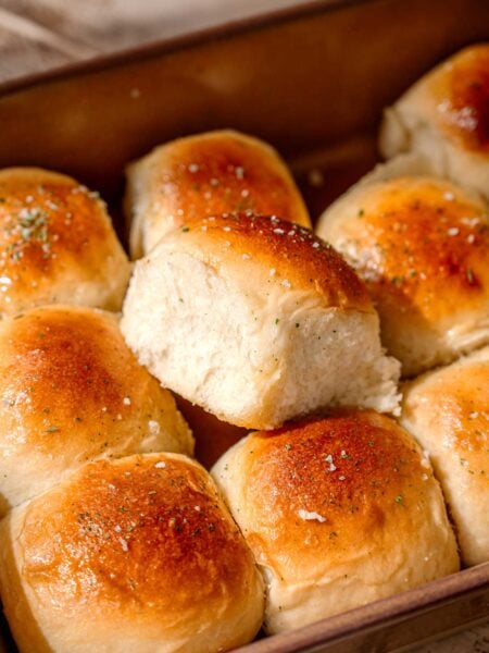 a tray of soft and fluffy vegan dinner rolls.