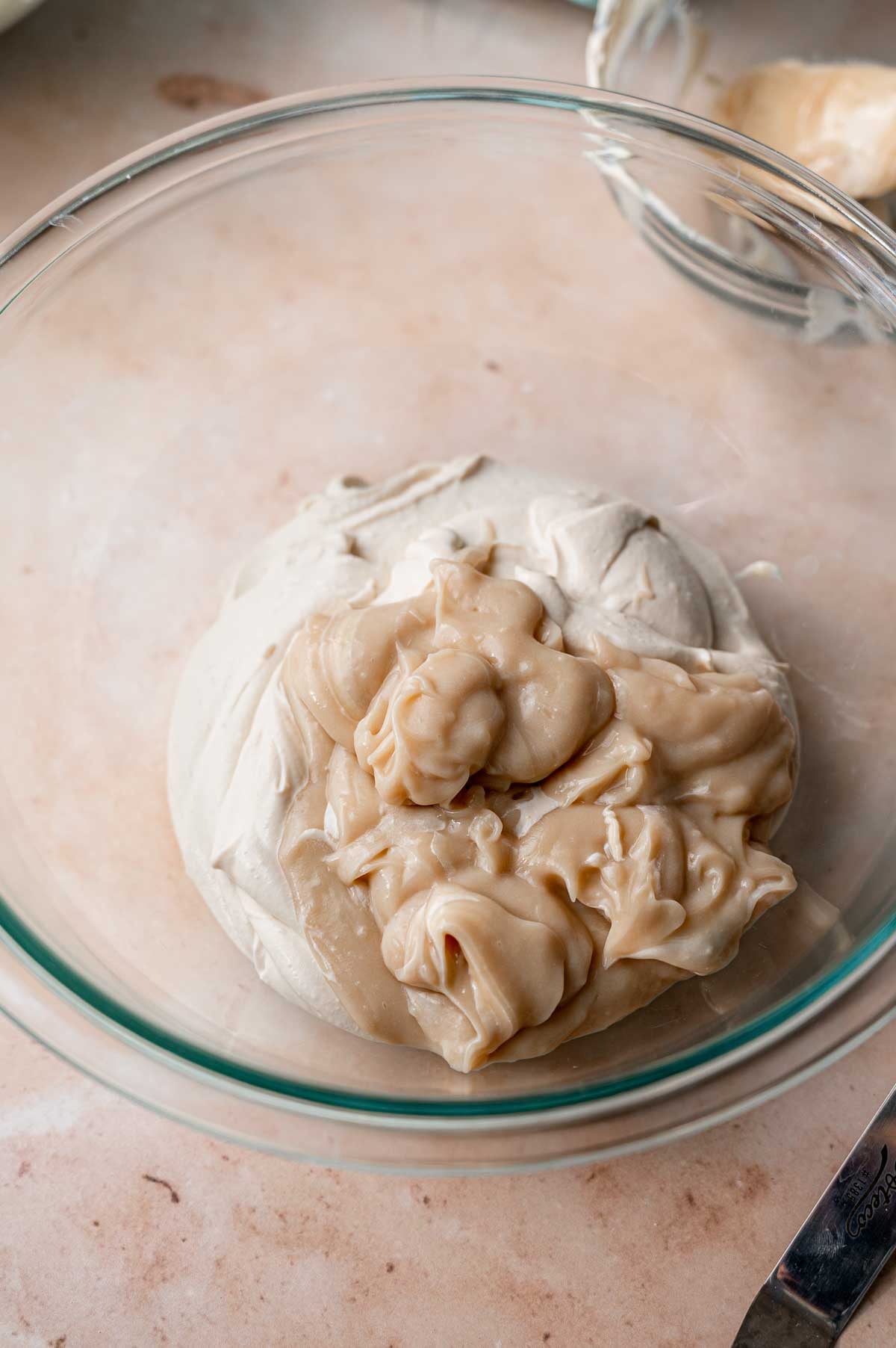 chilled vegan mascarpone cheese and dairy-free custard in a large bowl.
