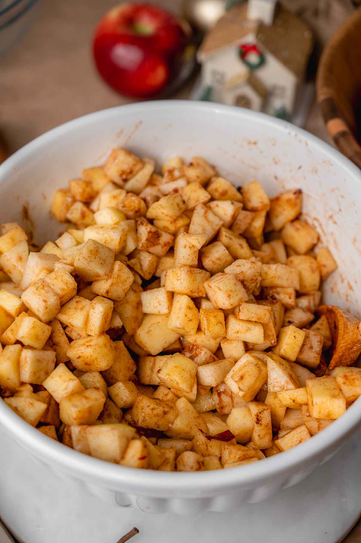 apples and pears in a large bowl with cinnamon.