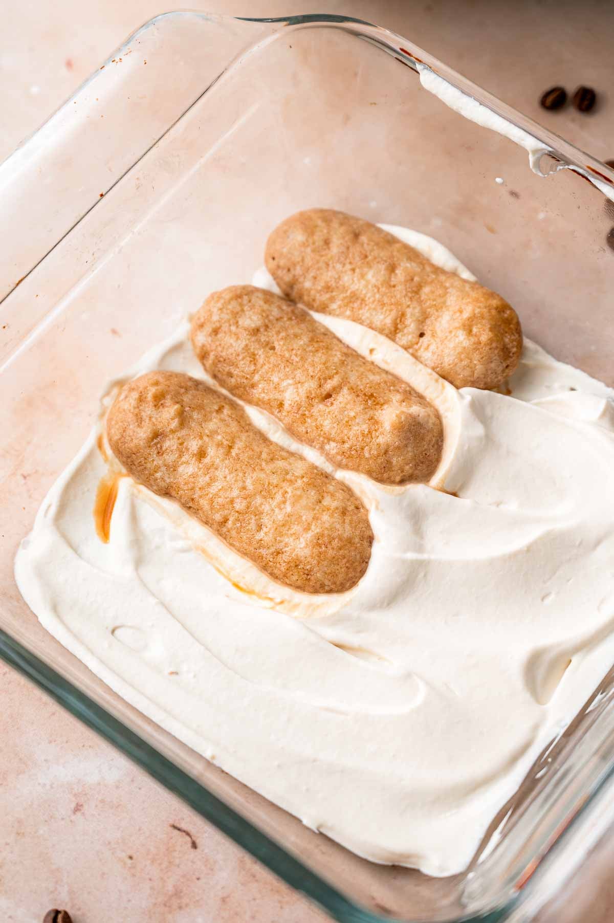 a layer of vegan mascarpone with soaked ladyfingers on top.