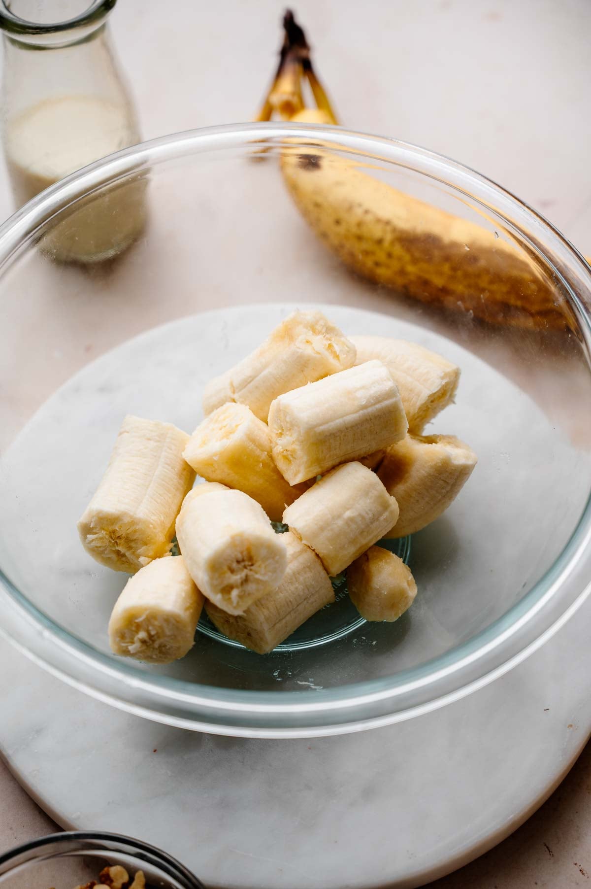 ripe bananas in a large glass bowl.