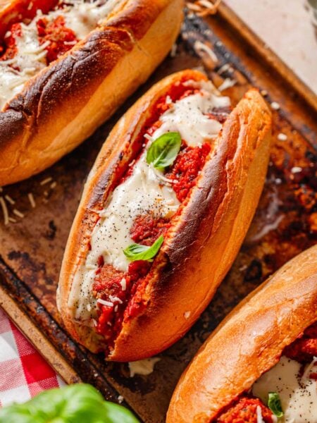 a toasted vegan meatball sub stuffed with homemade tvp meatballs and topped with a dairy-free cheese.
