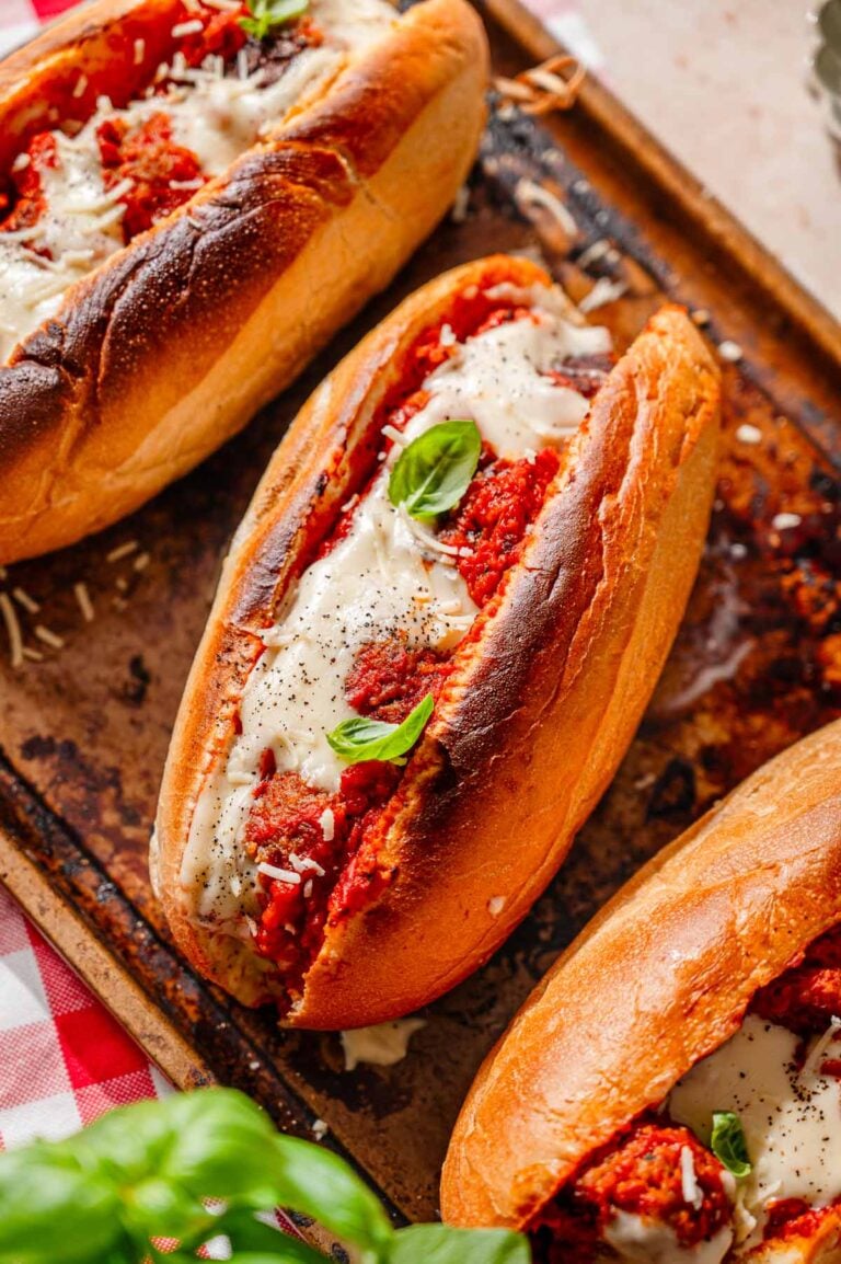 a toasted vegan meatball sub stuffed with homemade tvp meatballs and topped with a dairy-free cheese.