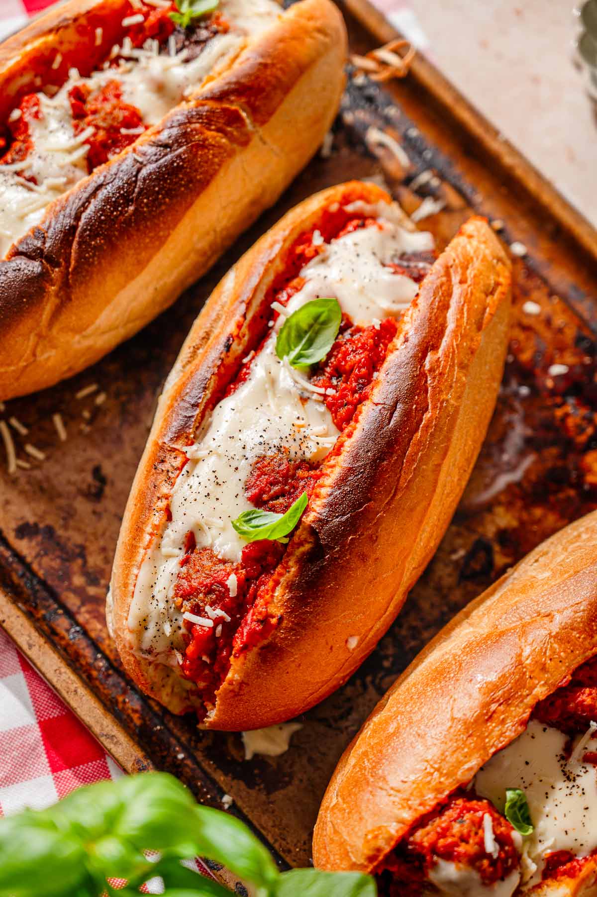 a toasted vegan meatball sub stuffed with homemade tvp meatballs and topped with a dairy-free cheese.