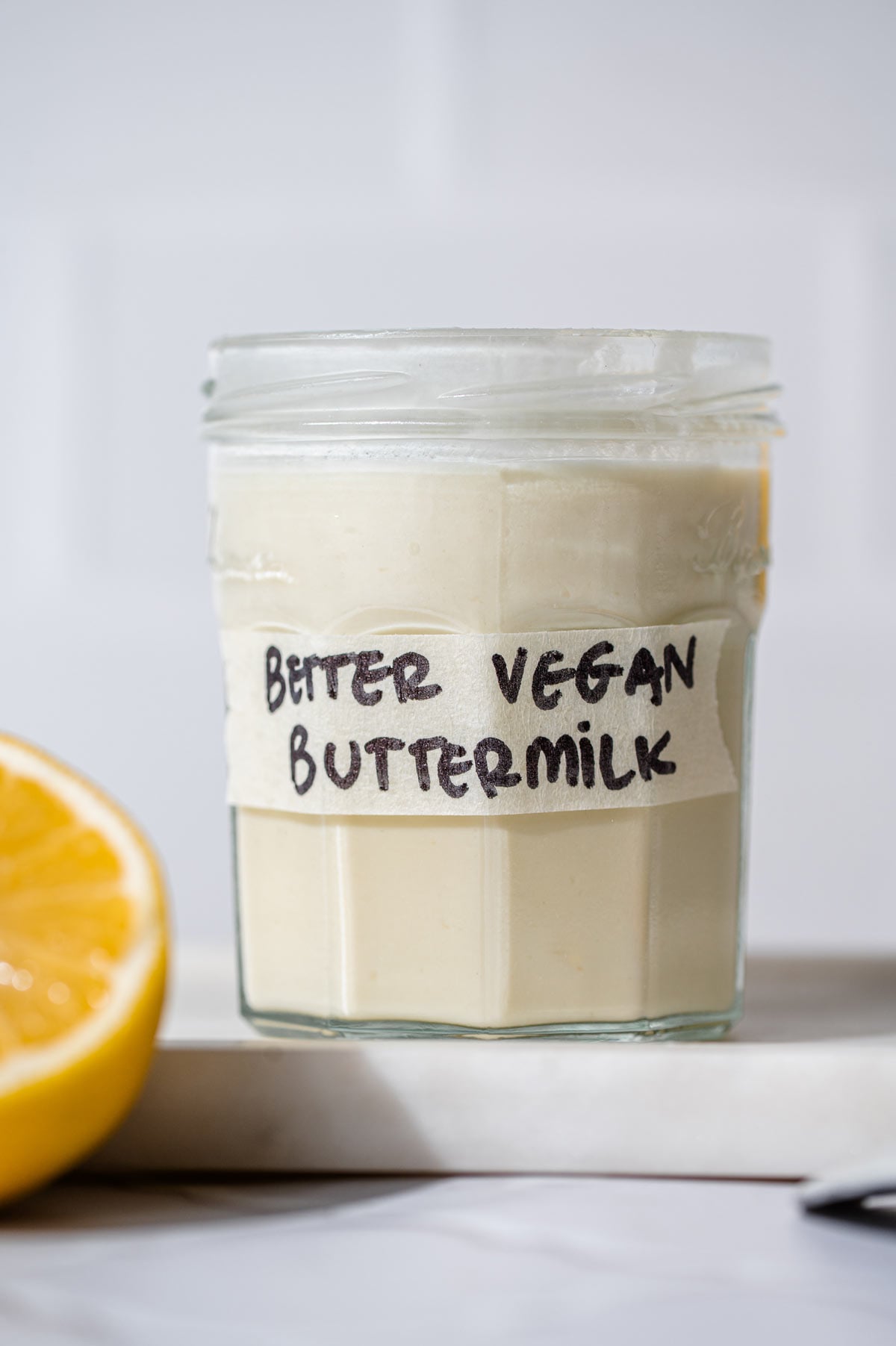 vegan buttermilk in a glass jar with a label.
