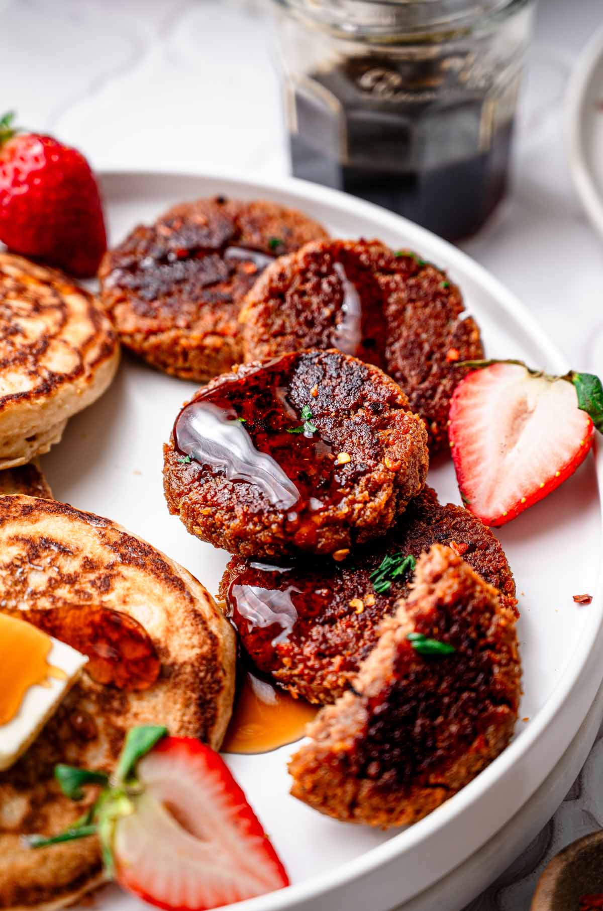 vegan breakfast sausages on a plate with pancakes.