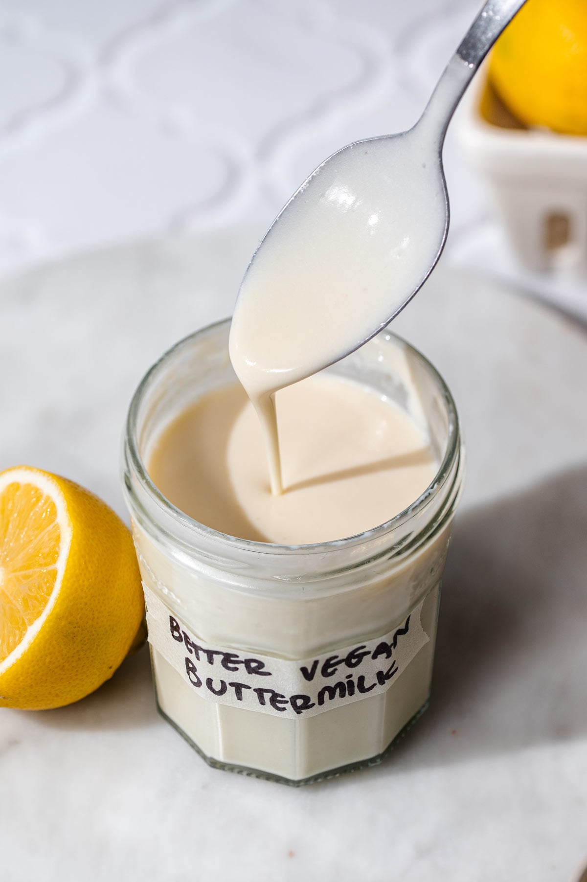 a jar of thick and creamy vegan buttermilk.
