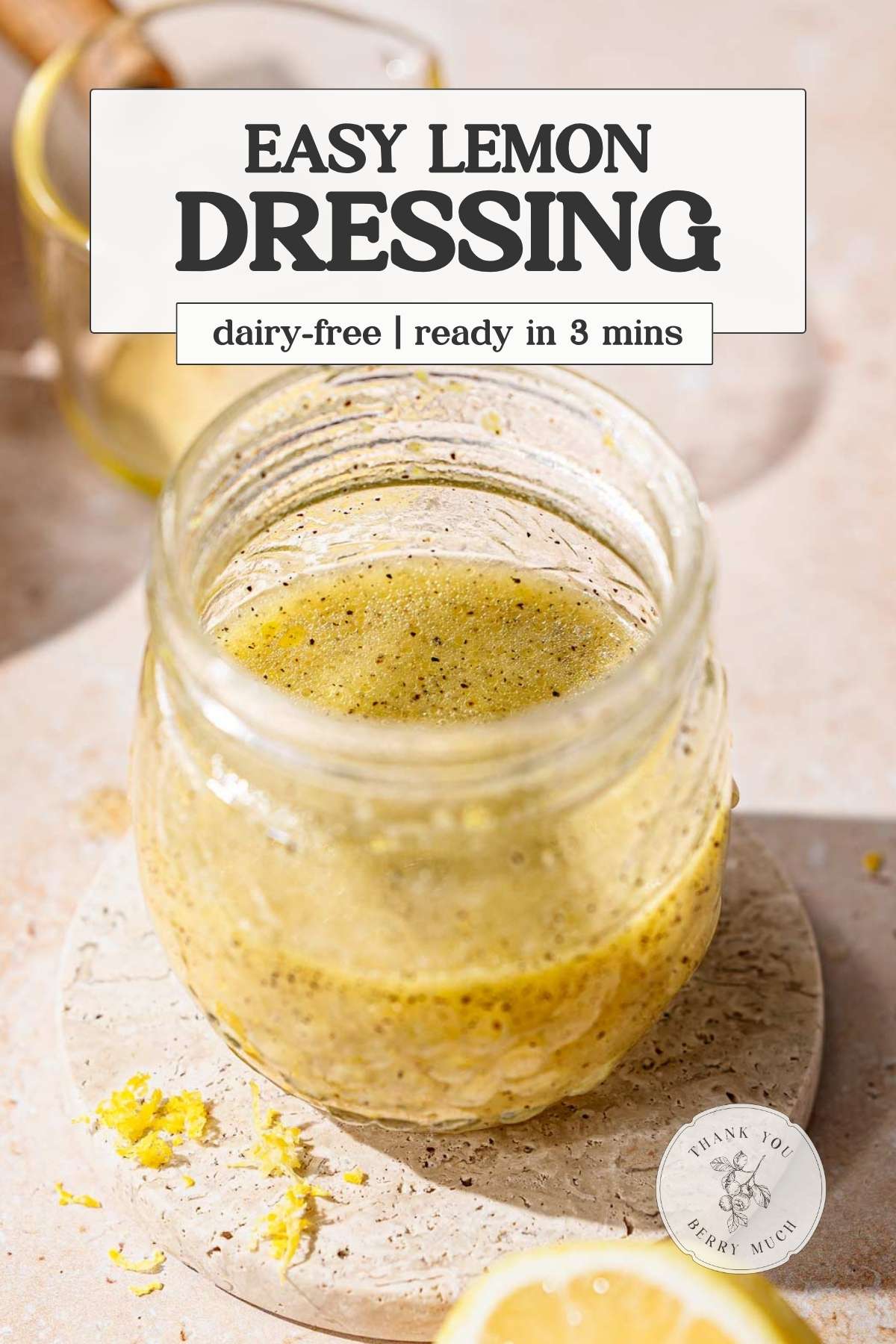 an image of a jar of lemon dijon dressing with a text overlay.