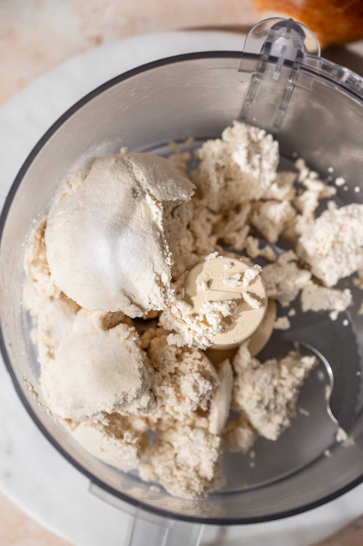 the strained dairy-free cheese curds in a food processor.