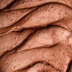 a macro close up of the dairy-free chocolate buttercream frosting.