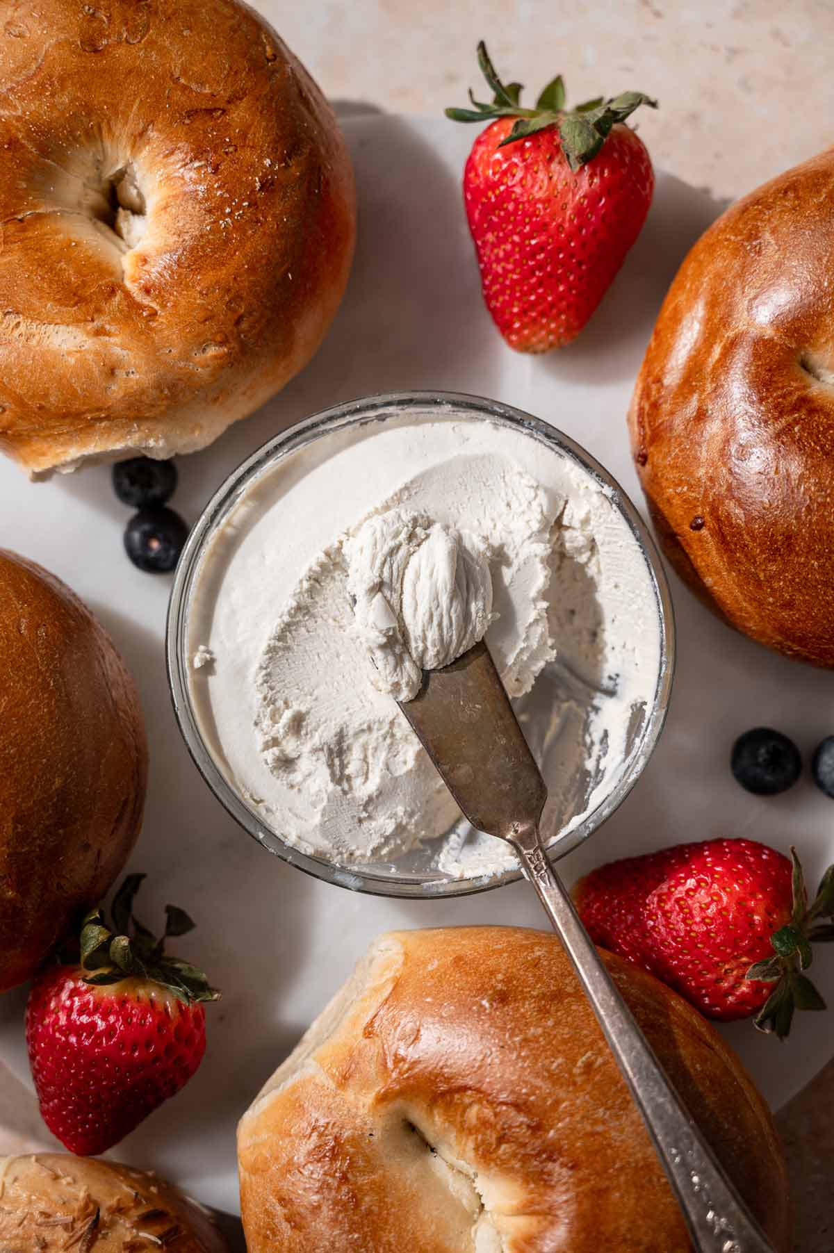 the thickened vegan cream cheese in a small glass container.