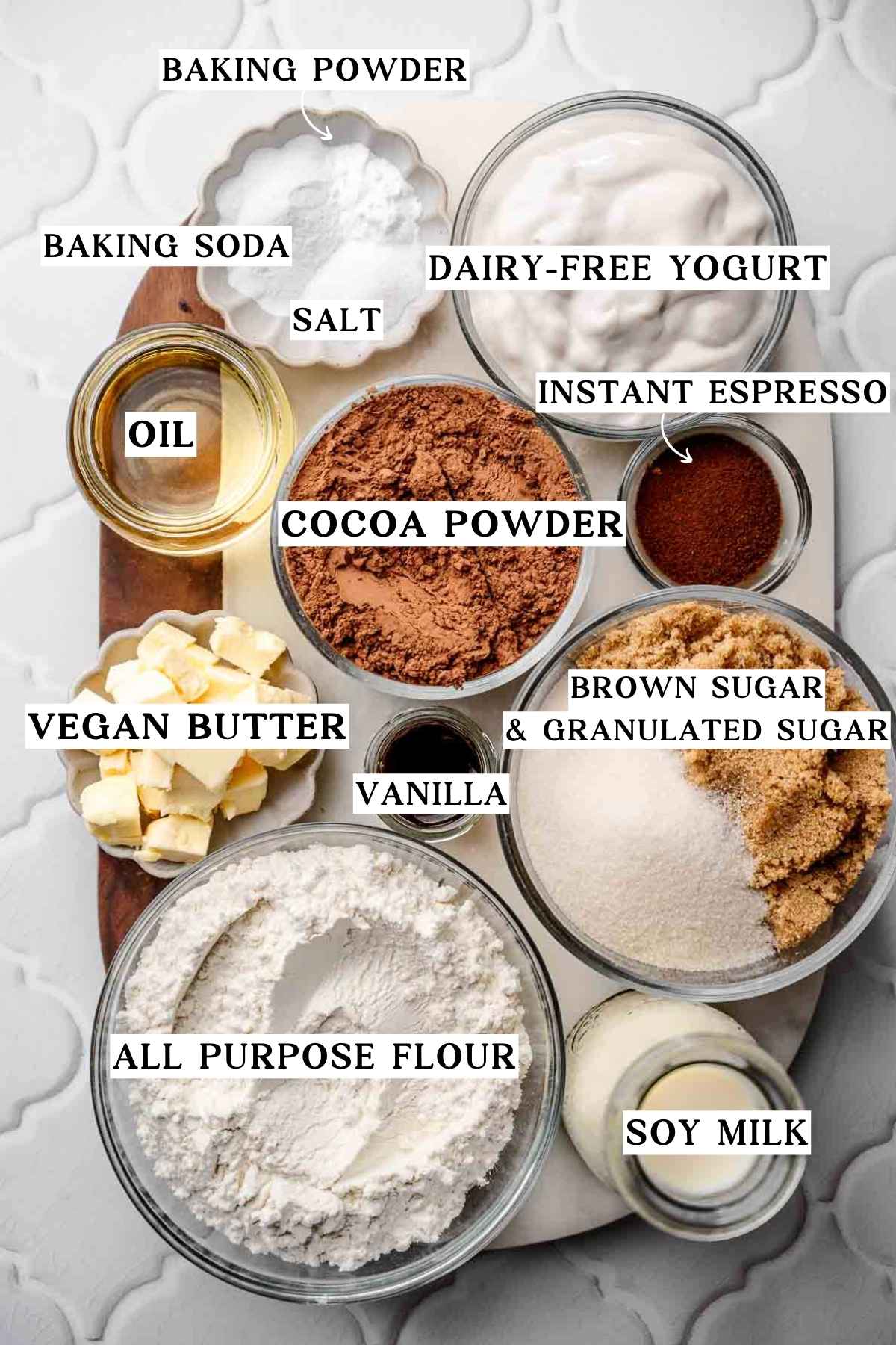 ingredients like flour, cocoa powder, sugar, leavening and dairy-free yogurt for chocolate cake.