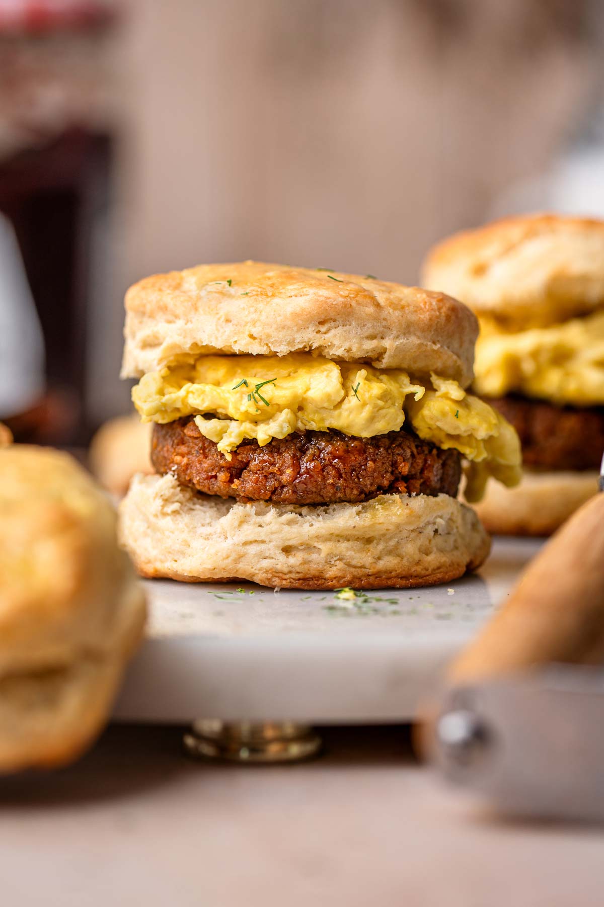a vegan sausage egg biscuit sandwich made with homemade dairy-free buttermilk biscuits.