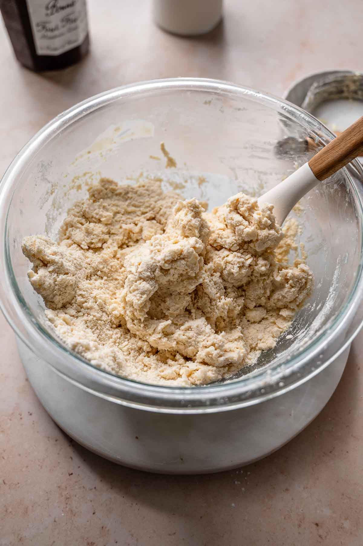 a large bowl with vegan biscuit dough.