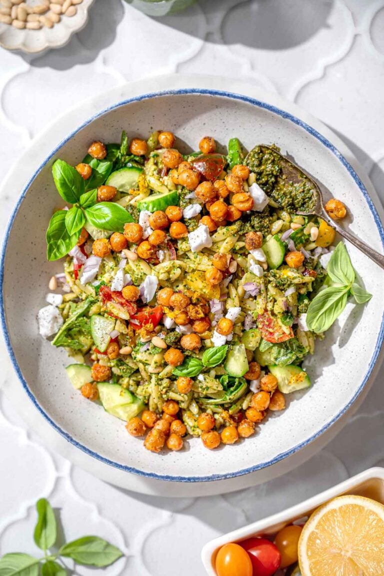 pesto orzo salad topped with roasted lemon chickpeas.