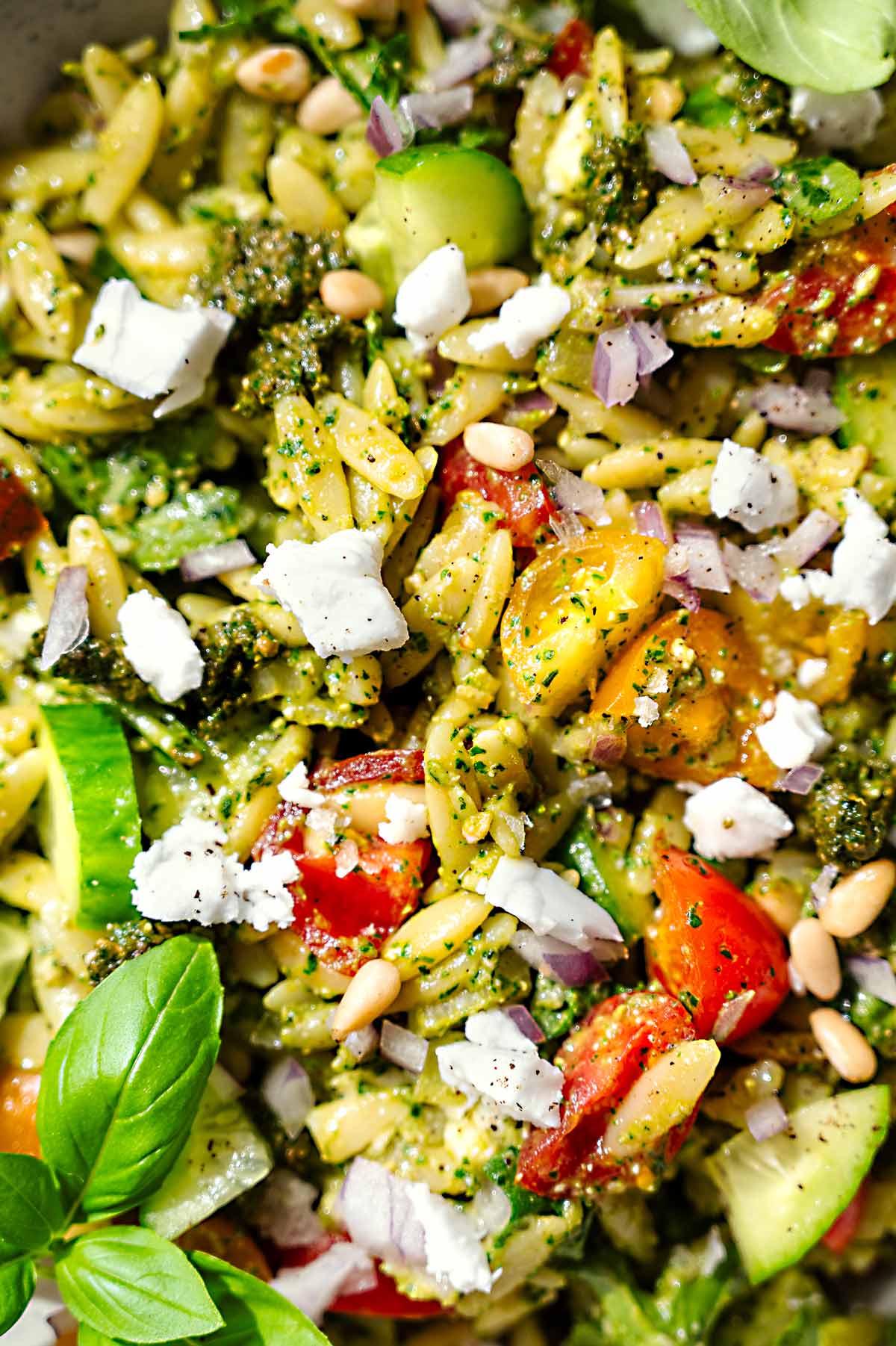 a close up of the pesto coated orzo pasta.
