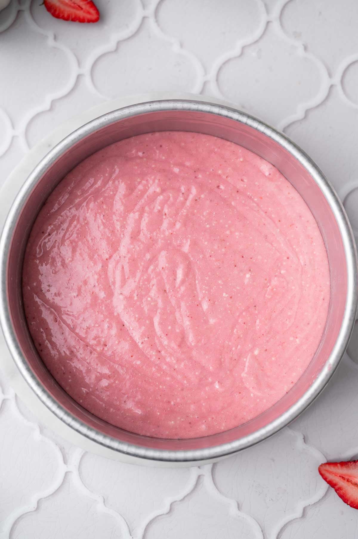 dairy-free and eggless strawberry cake batter in the baking pan.