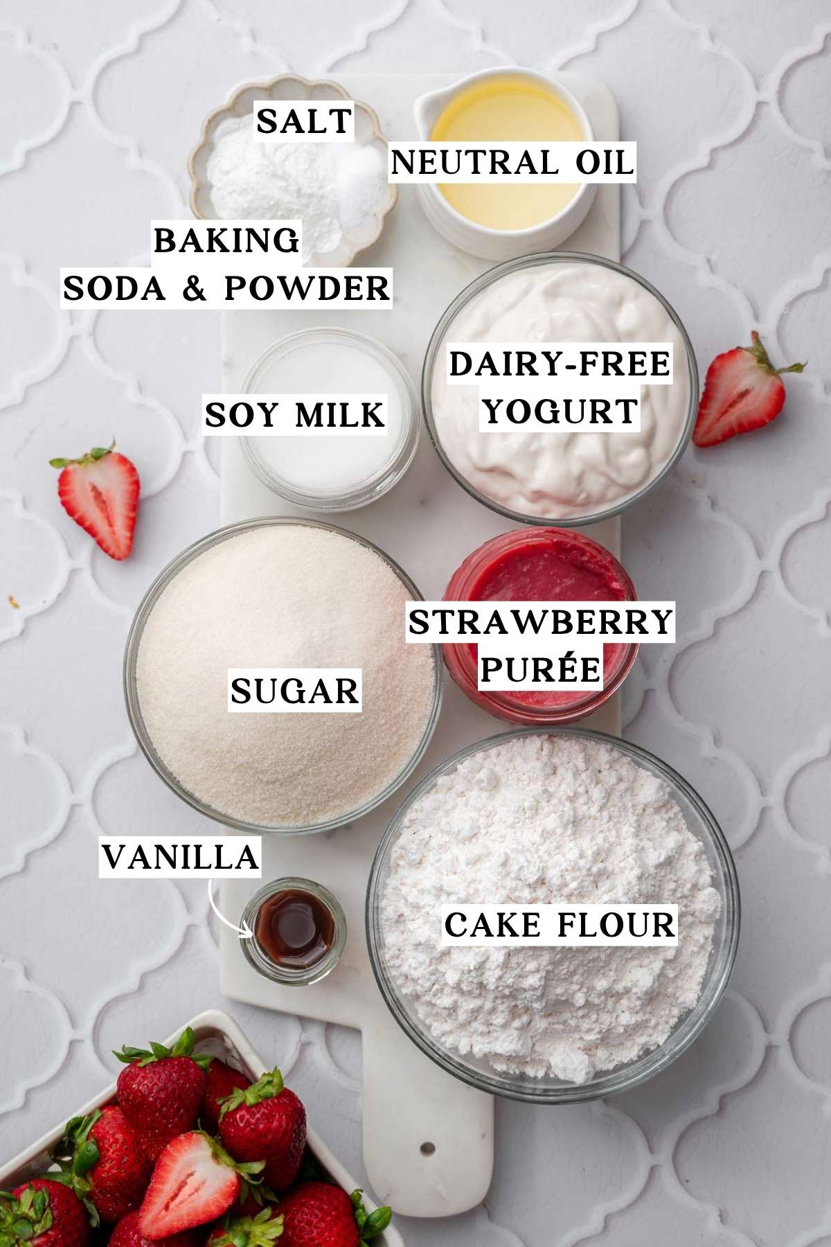 ingredients like cake flour, strawberries, sugar and more on a marble tray.