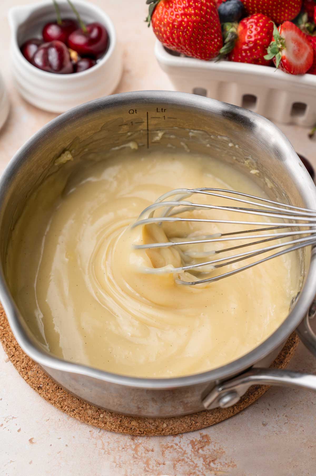 thick and creamy vegan custard in a saucepan.