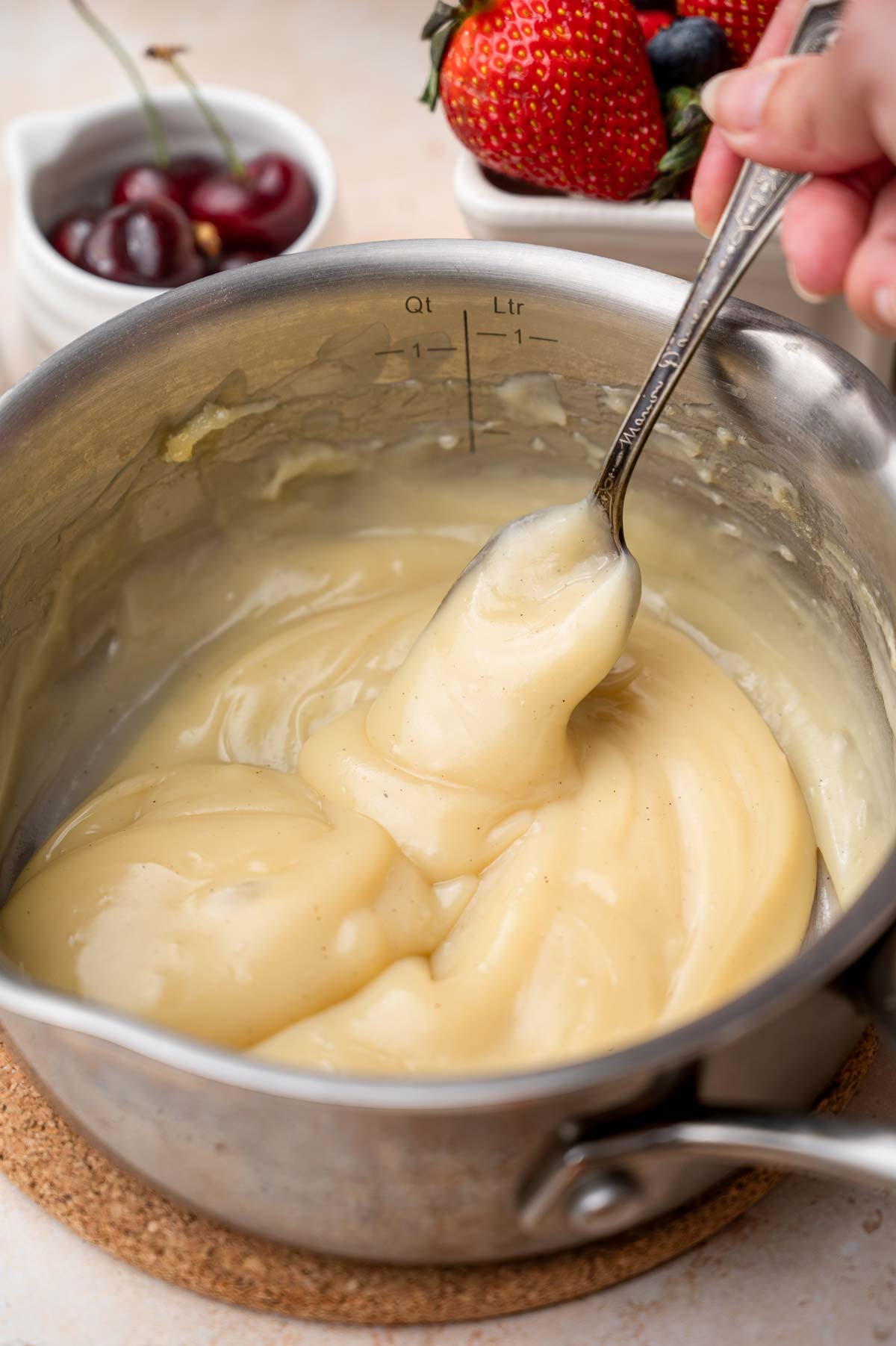 the thickened vegan custard in a pot.