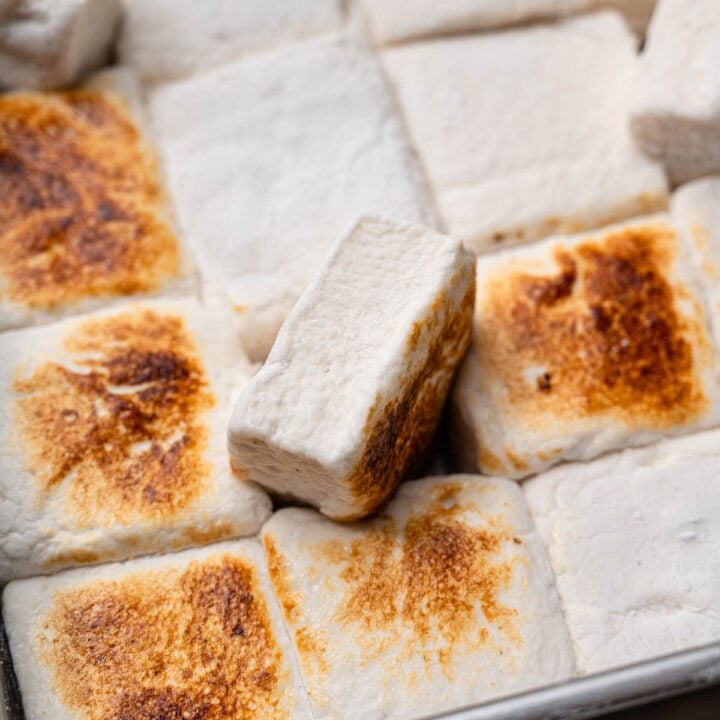 Toasted vegan marshmallows in a pan with golden brown tops.