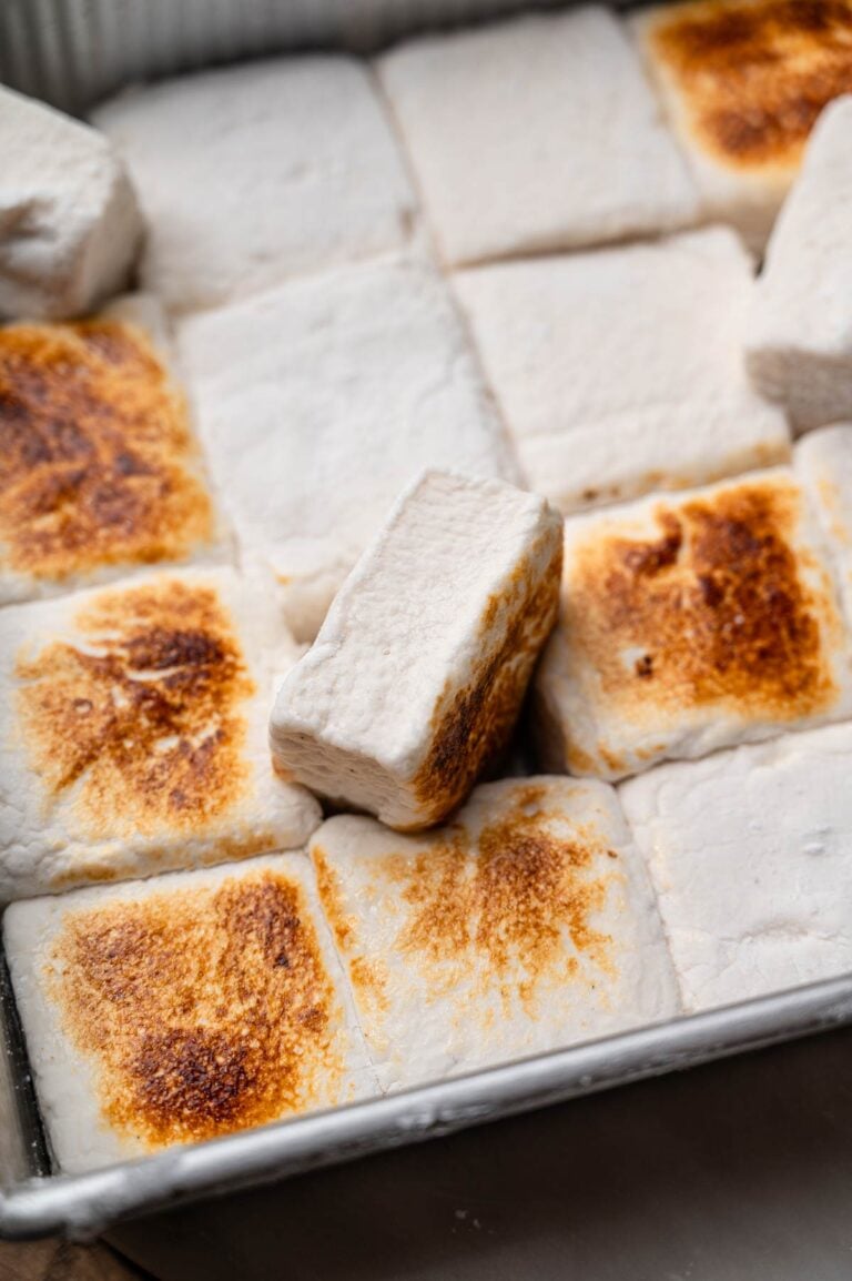 Toasted vegan marshmallows in a pan with golden brown tops.