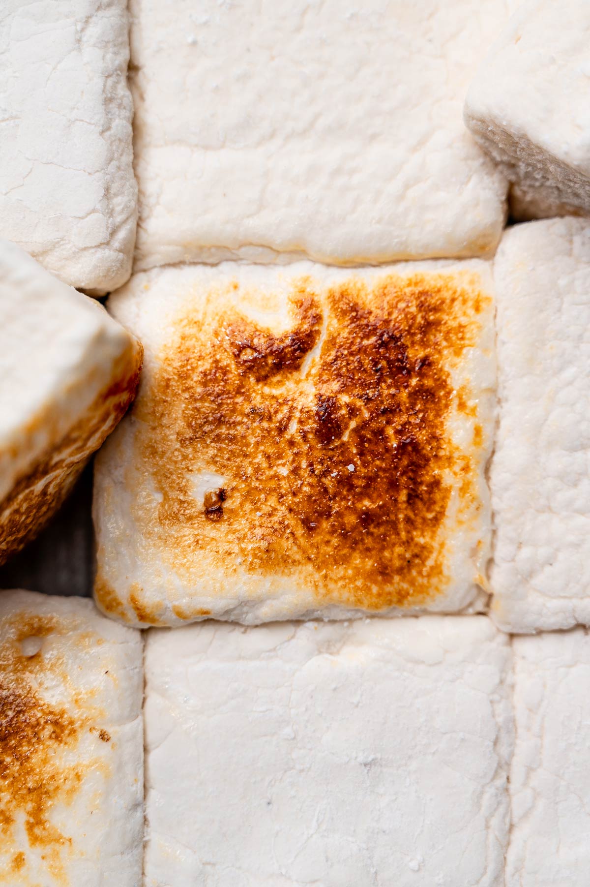 Close-up of toasted vegan marshmallow with golden caramelized top.