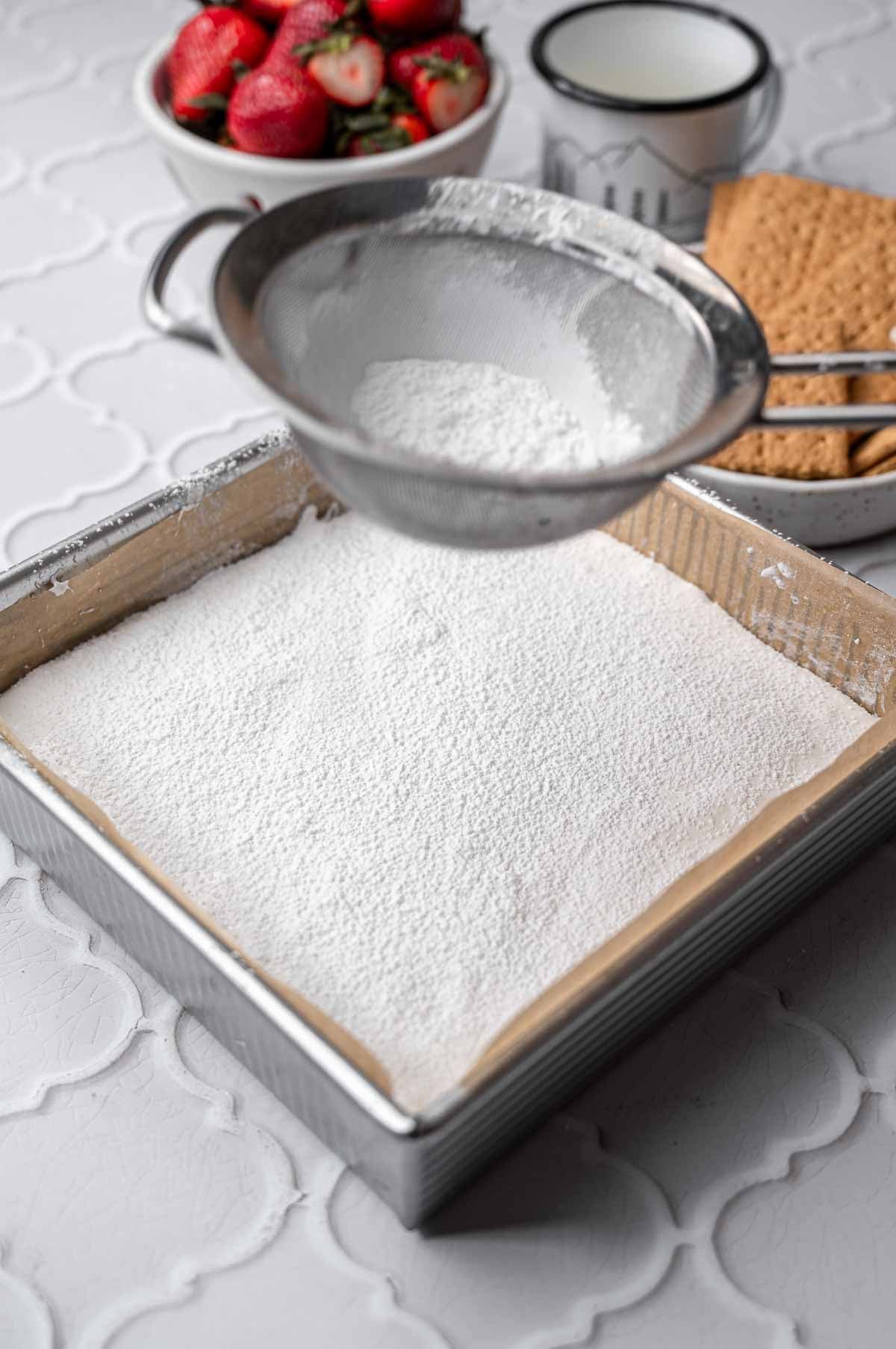dusting the top of the marshmallow with starch.