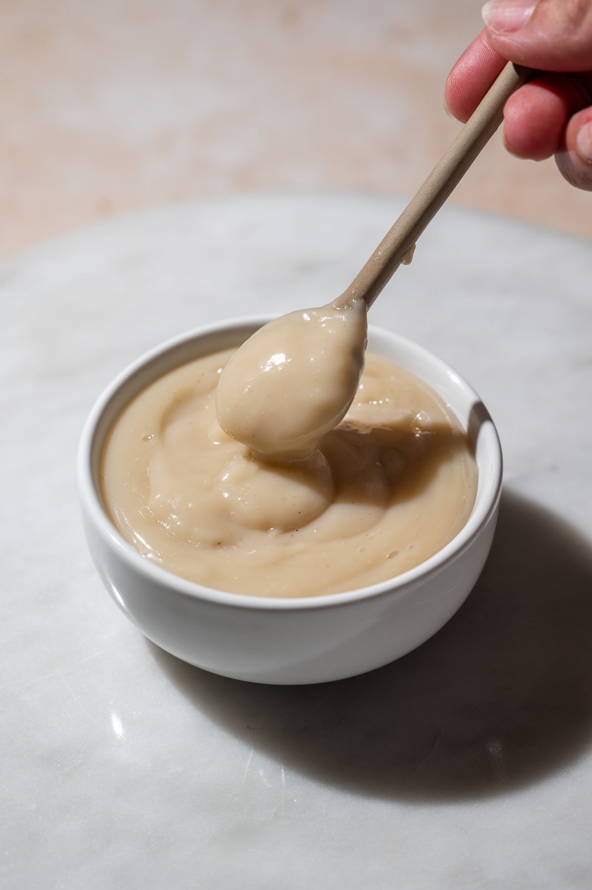 a small bowl filled with oat milk custard after cooking.