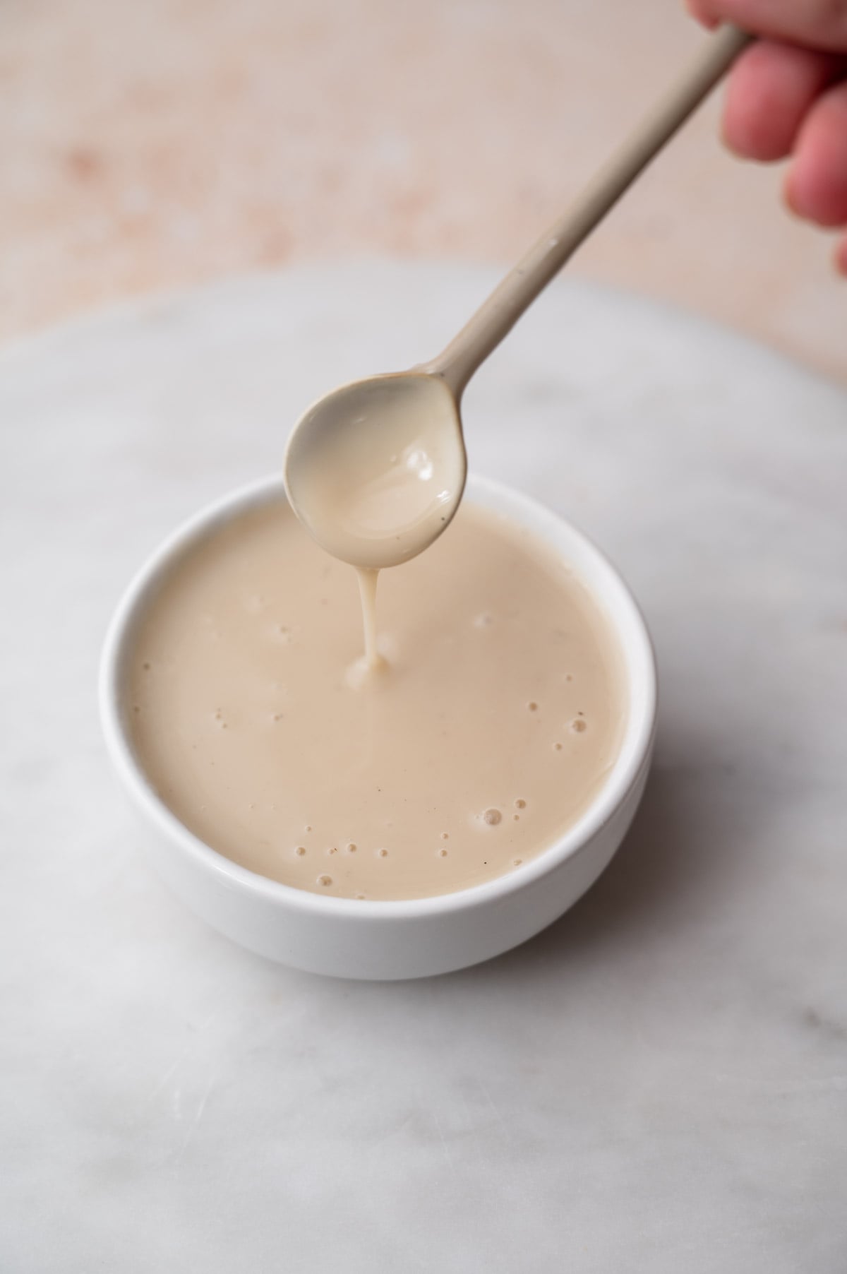 a small bowl filled with oat milk custard after chillling.
