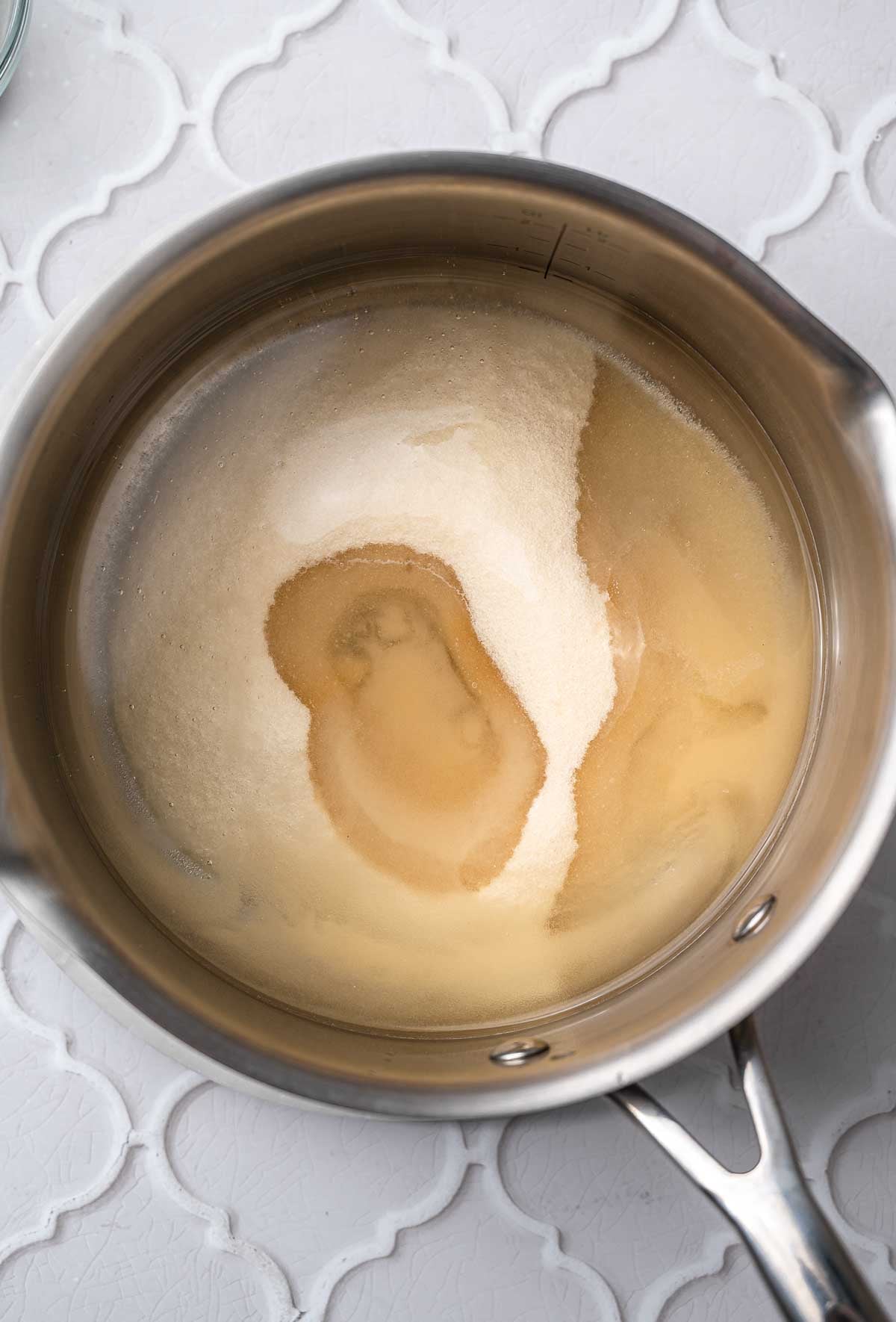 sugar, corn syrup and water in a saucepan.